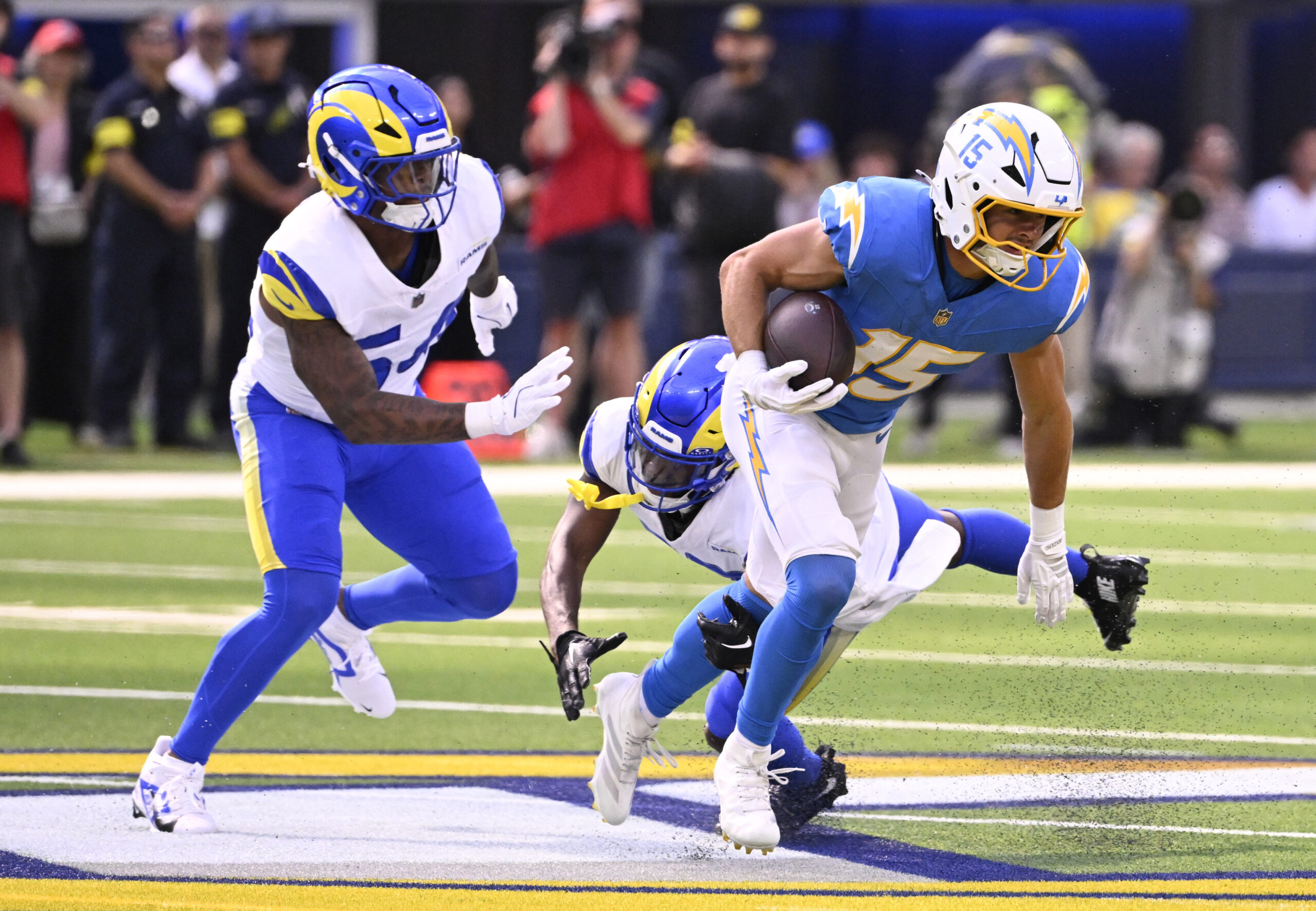 Wide receiver Ladd McConkey #15 of the Chargers catches a...