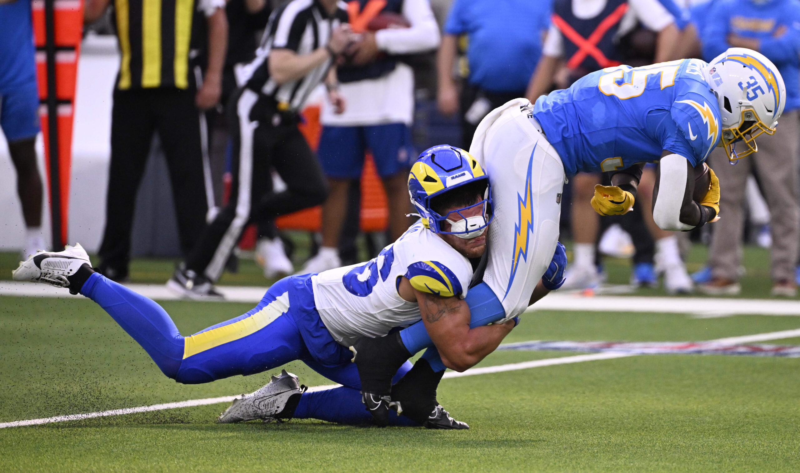 Running back Raheim Sanders #35 of the Chargers is tackled...