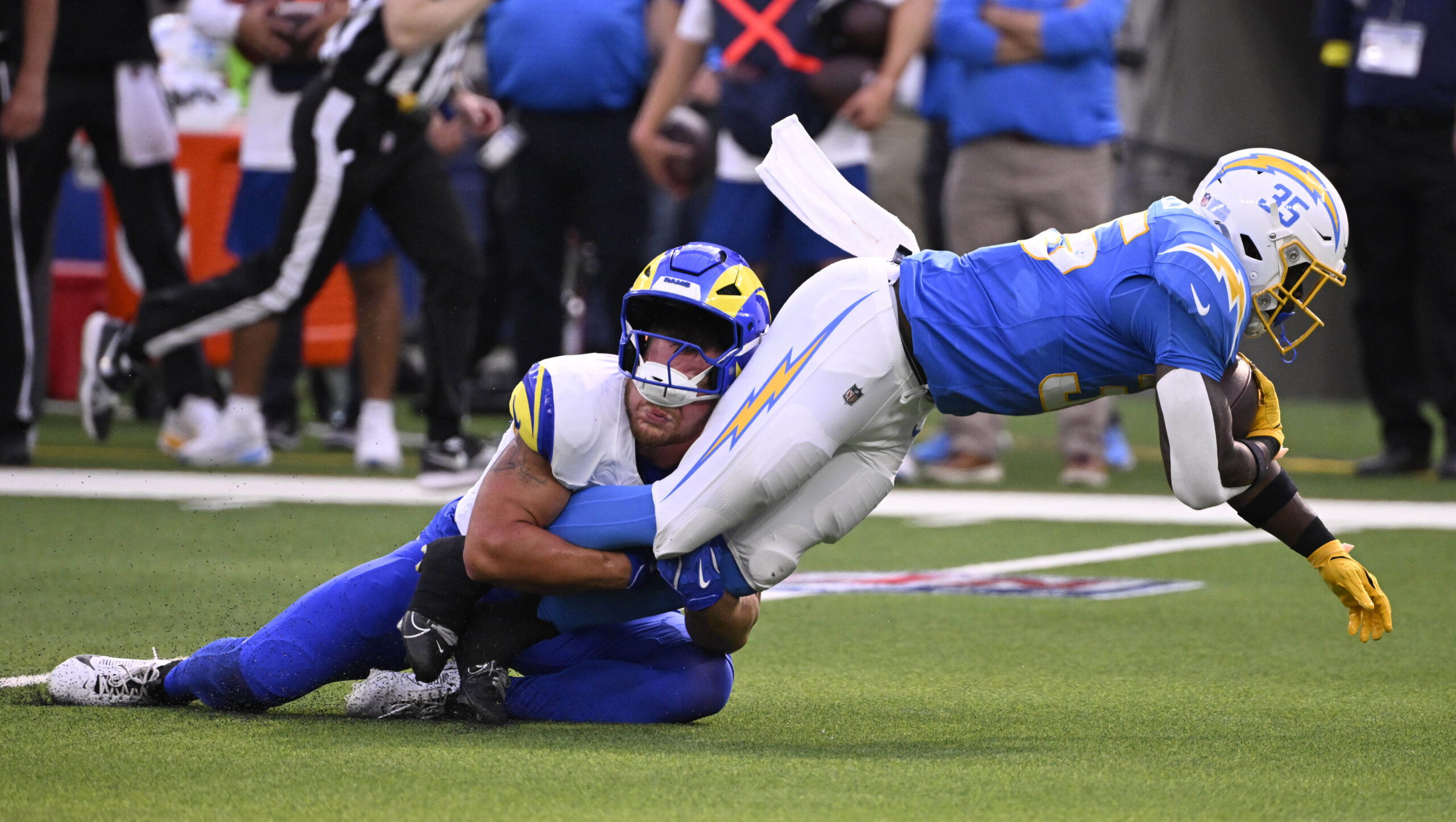 Running back Raheim Sanders #35 of the Chargers is tackled...