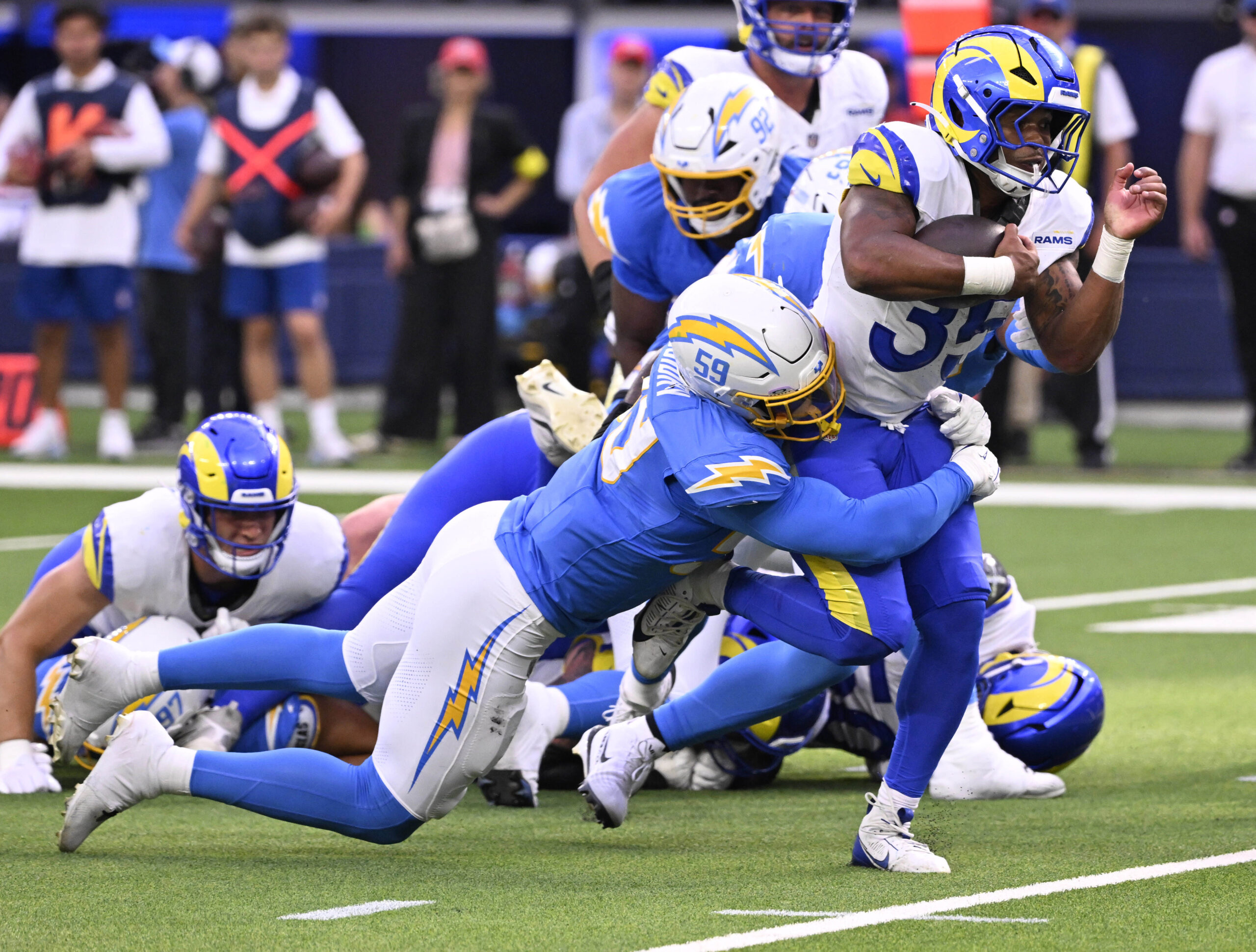 Running back Jarquez Hunter #35 of the Rams runs for...