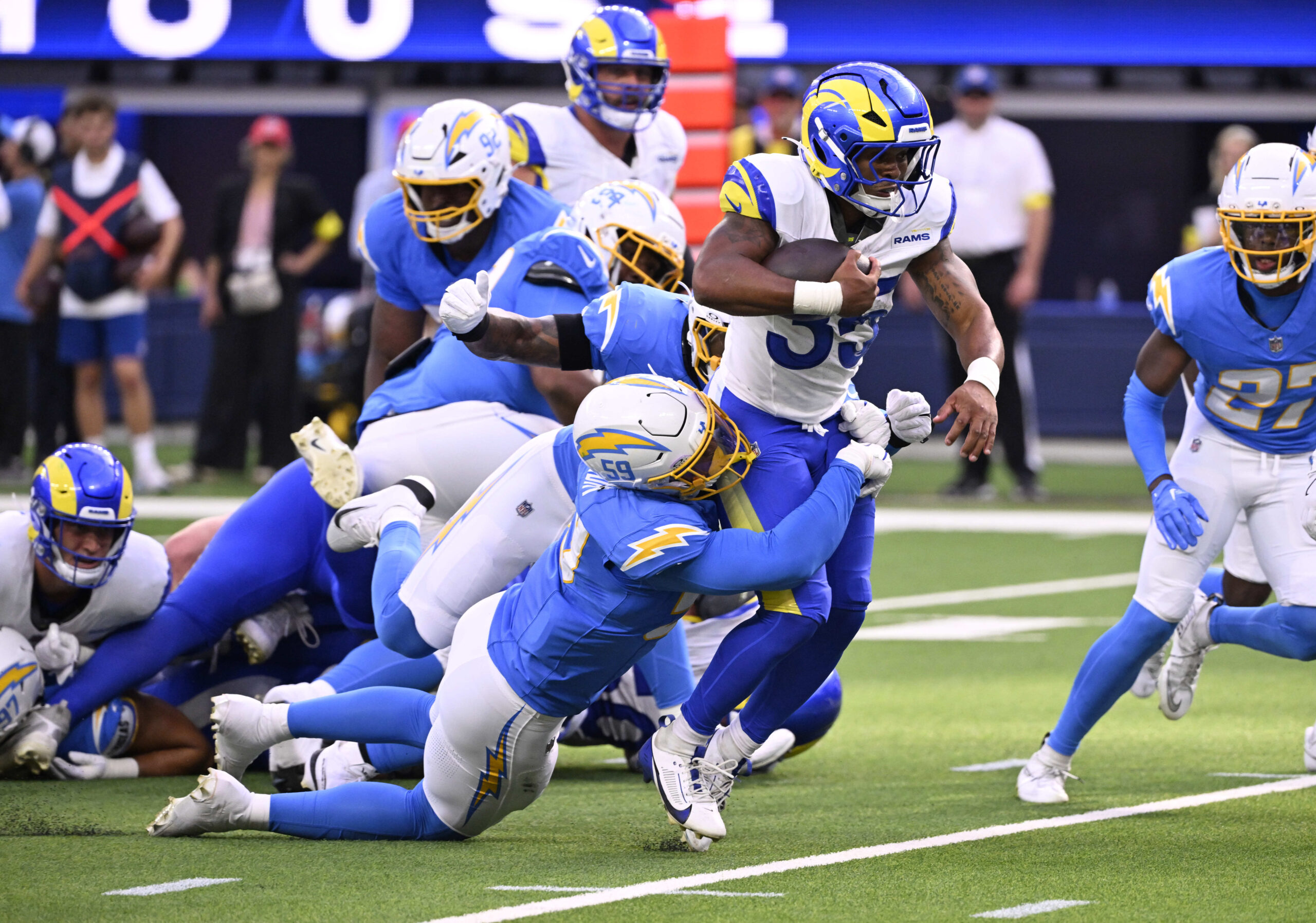 Running back Jarquez Hunter #35 of the Rams runs for...