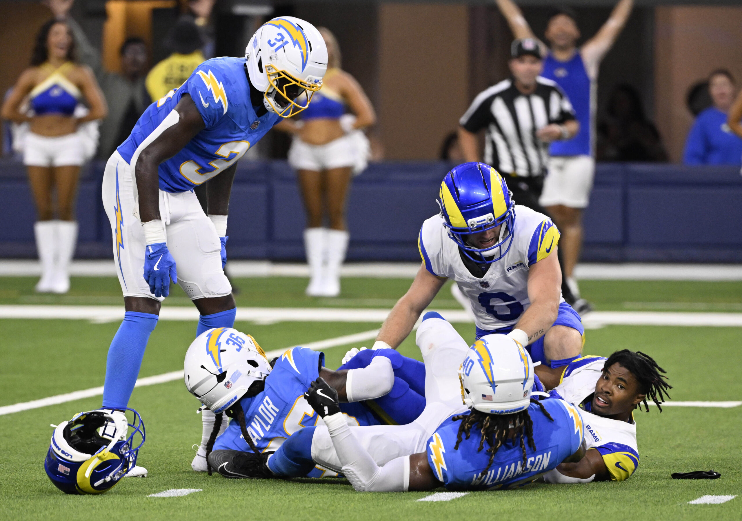 Wide receiver Brennan Presley, right, of the Rams catches a...