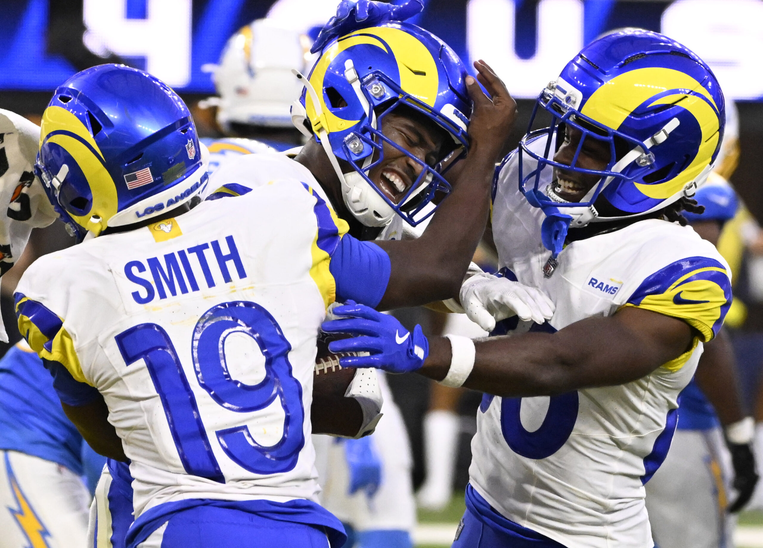 Wide receiver Tru Edwards, center, of the Rams reacts after...