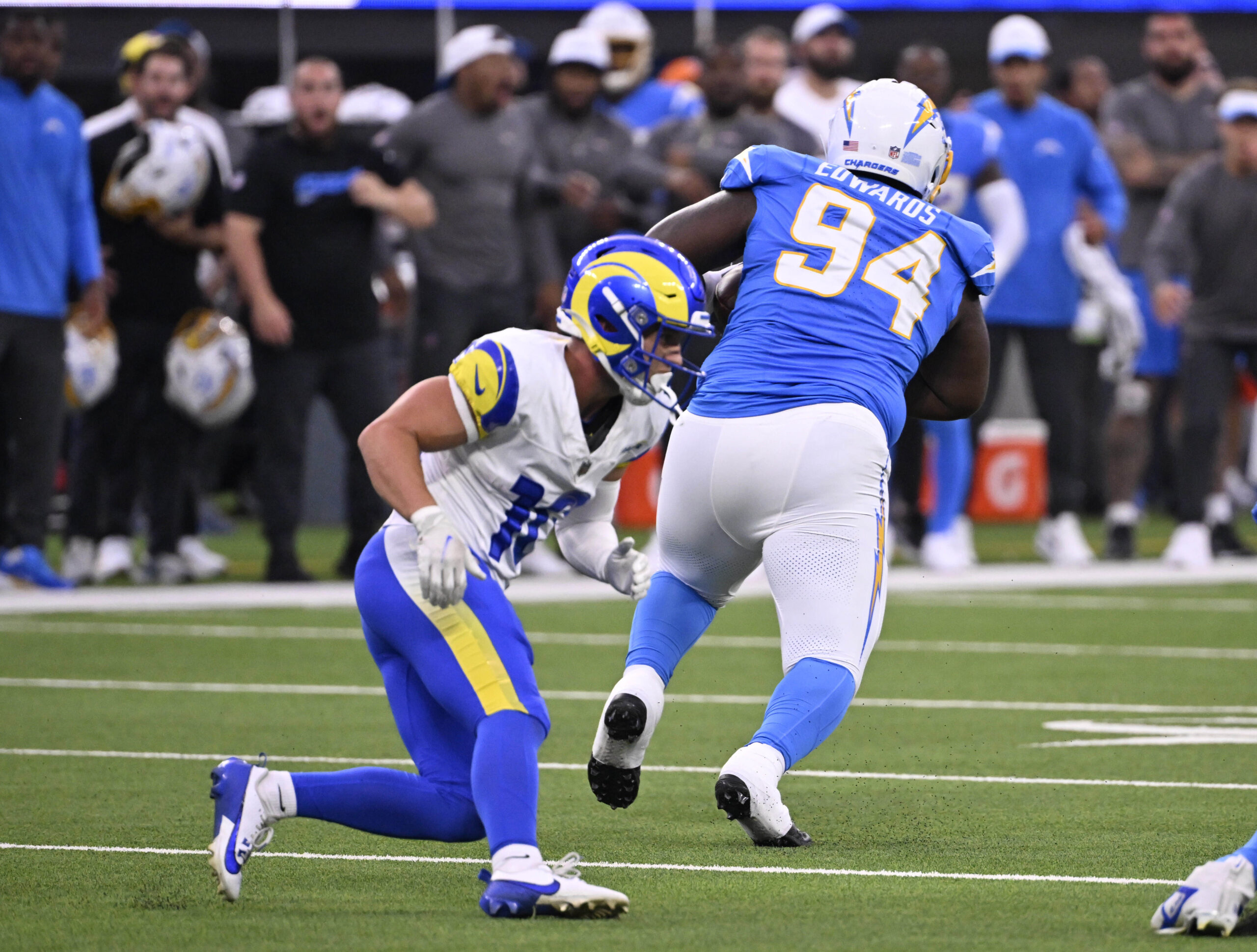 Defensive tackle TeRah Edwards #94 of the Chargers intercepts a...