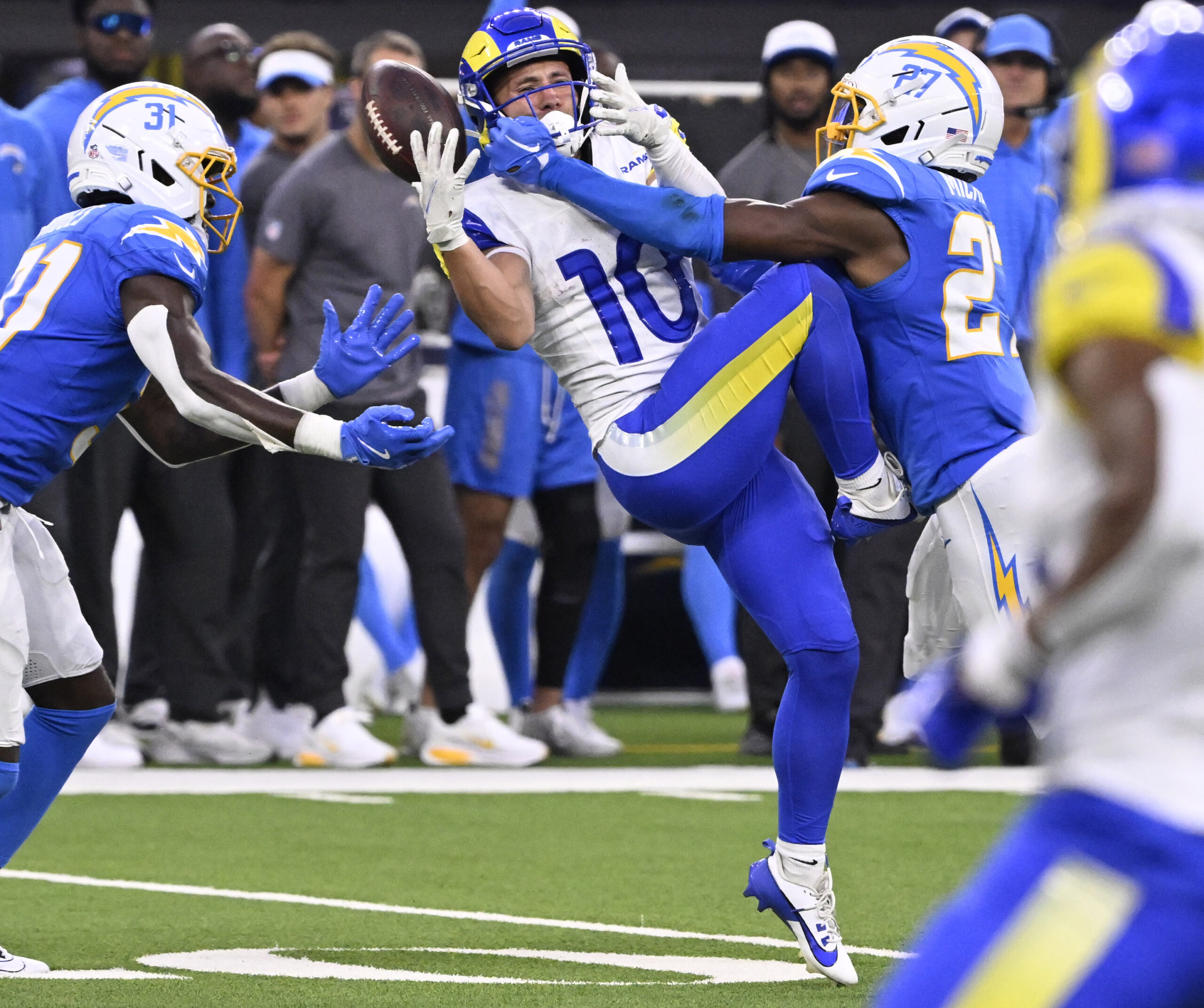 Wide receiver Britain Covey #10 of the Rams drops a...