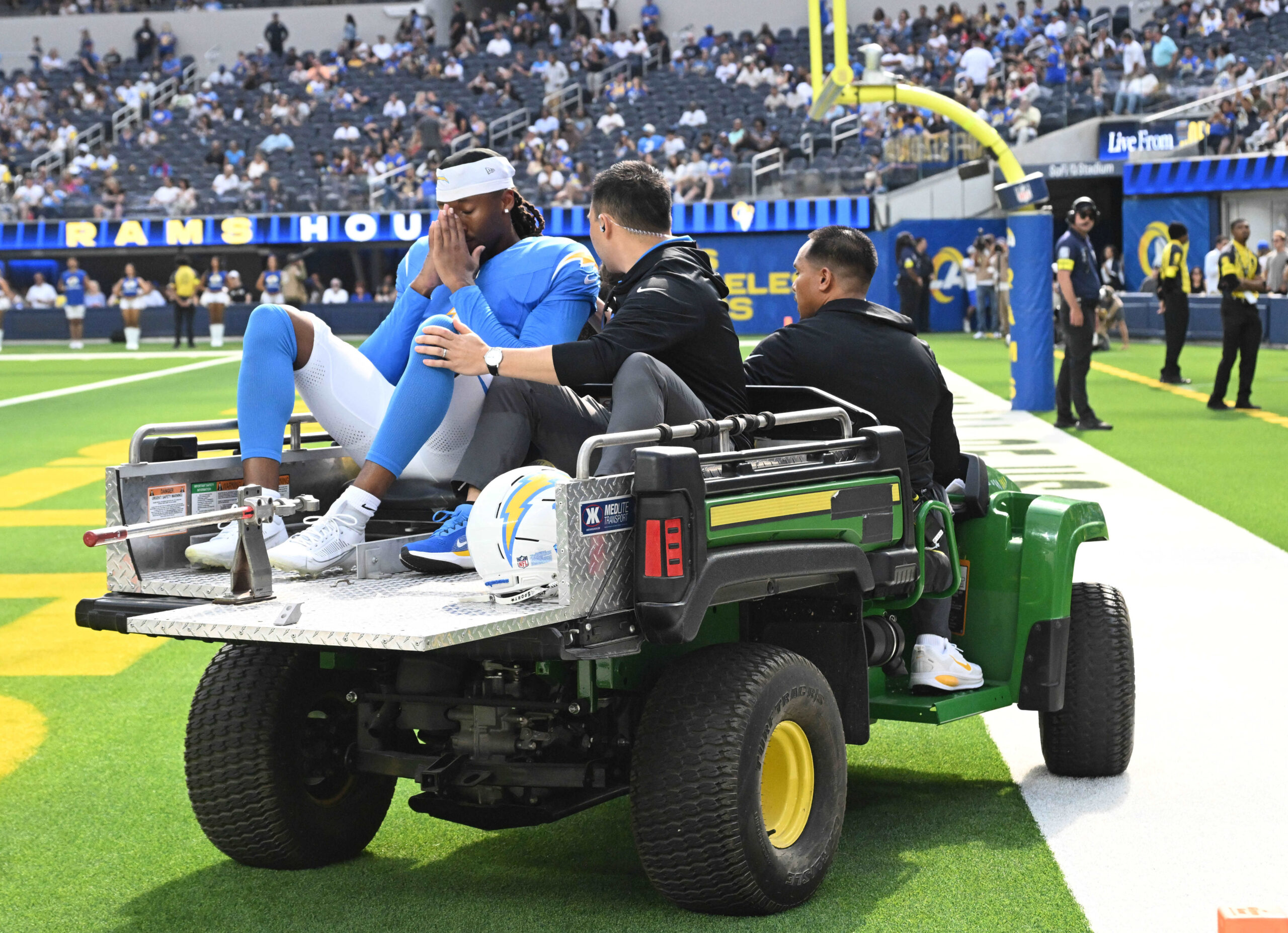 Wide receiver Quentin Johnston #1 of the Chargers is carted...