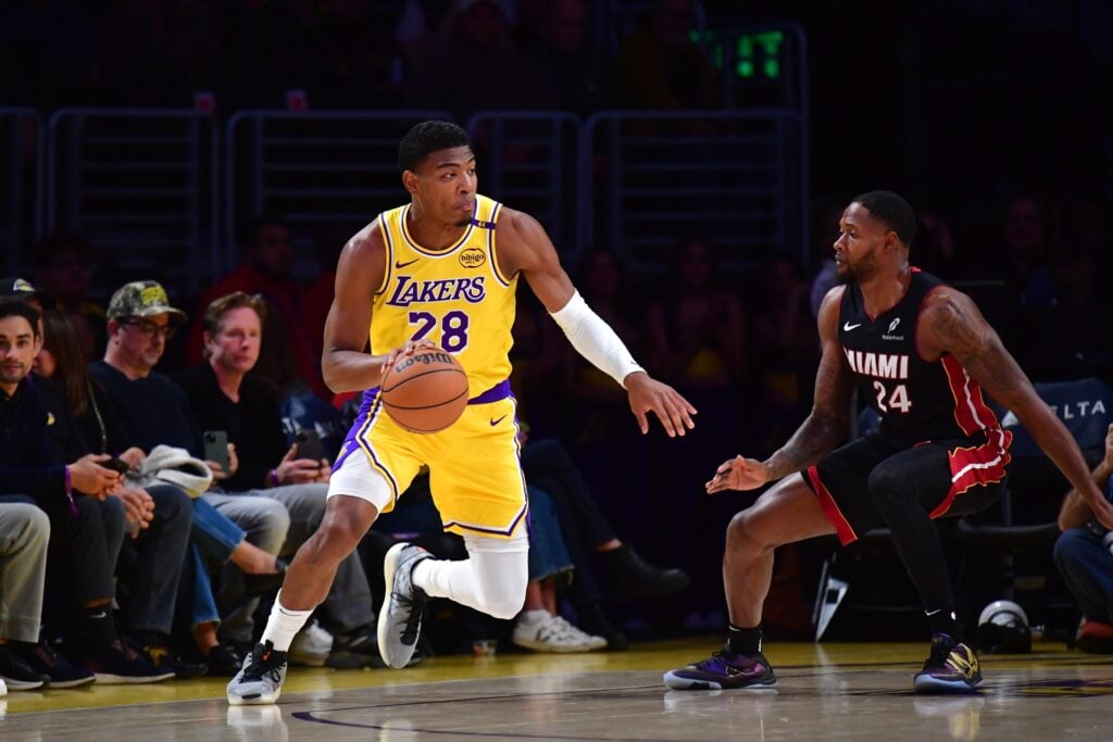 Jan 15, 2025; Los Angeles, California, USA; Los Angeles Lakers forward Rui Hachimura (28) moves the ball against Miami Heat forward Haywood Highsmith (24) during the first half at Crypto.com Arena. Mandatory Credit: Gary A. Vasquez-Imagn Images