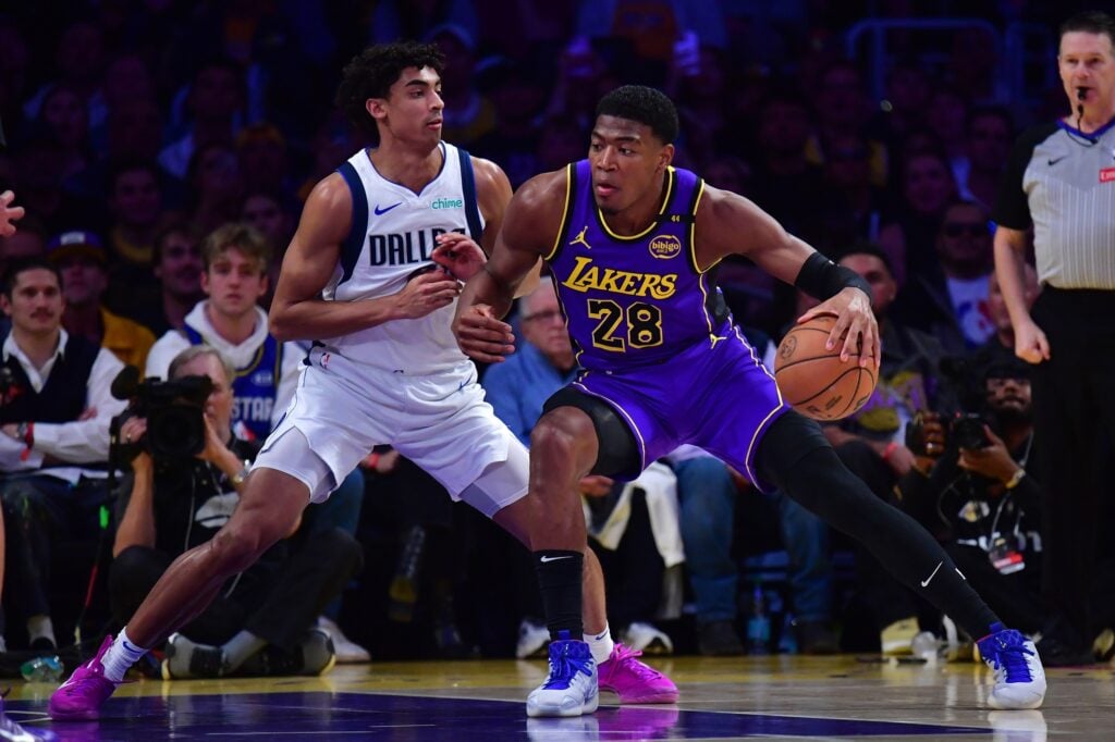 Feb 25, 2025; Los Angeles, California, USA; Los Angeles Lakers forward Rui Hachimura (28) dribbles the ball on Dallas Mavericks guard Max Christie (00) during the first quarter at Crypto.com Arena. Mandatory Credit: Gary A. Vasquez-Imagn Images