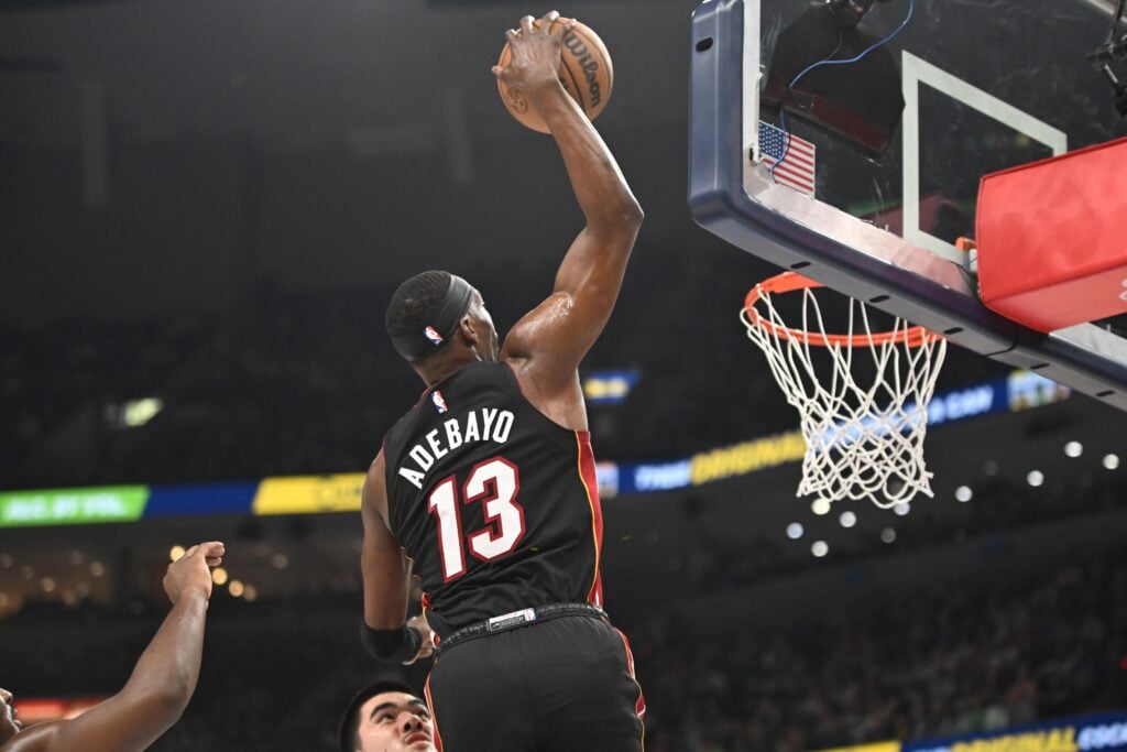 Mar 15, 2025; Memphis, Tennessee, USA; Miami Heat center Bam Adebayo (13) dunks the ball in the first quarter of the game against the Memphis Grizzlies at FedExForum. Mandatory Credit: Matthew Smith-Imagn Images