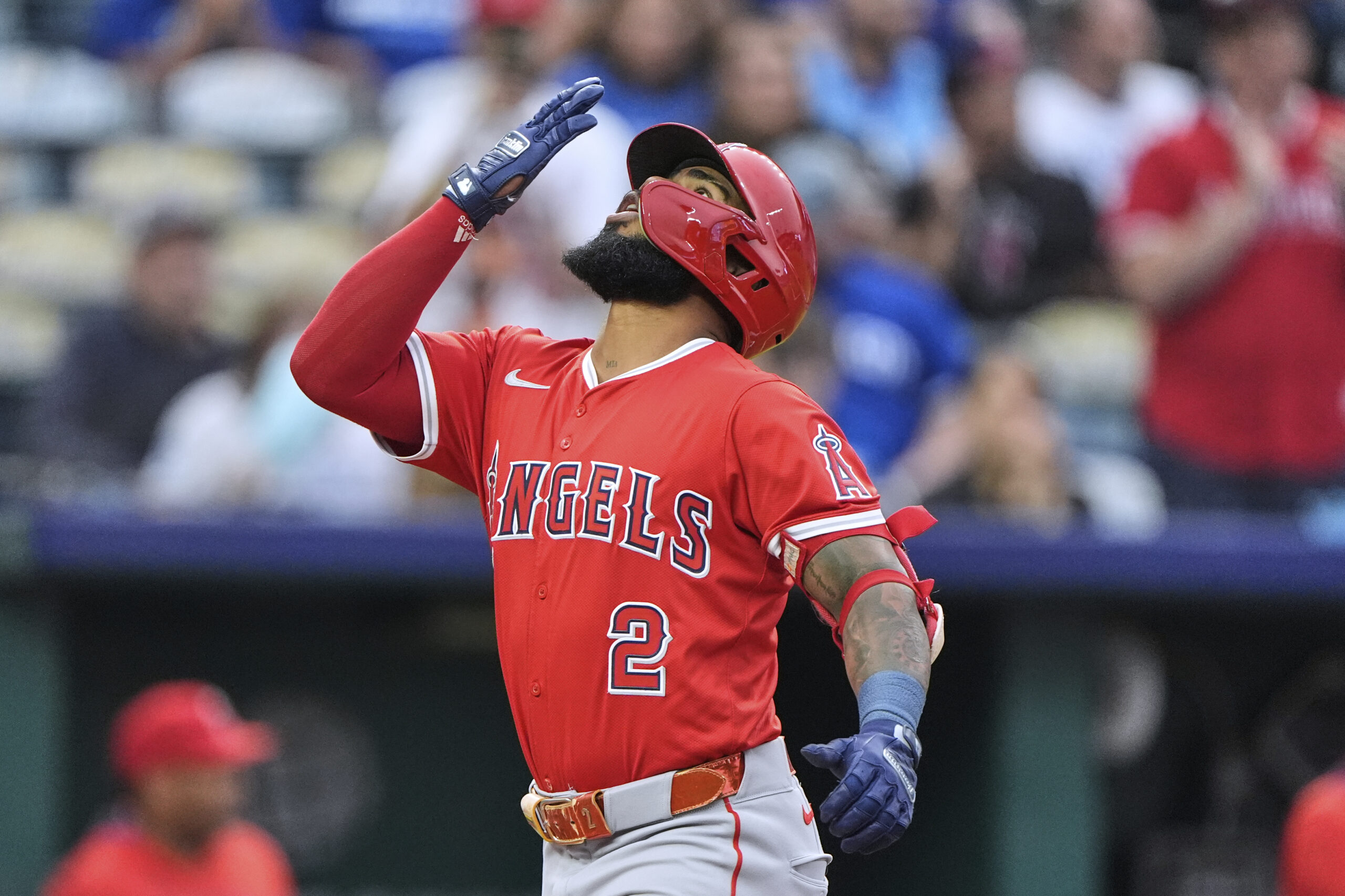 The Angels’ Luis Rengifo (2) celebrates as he crosses the...