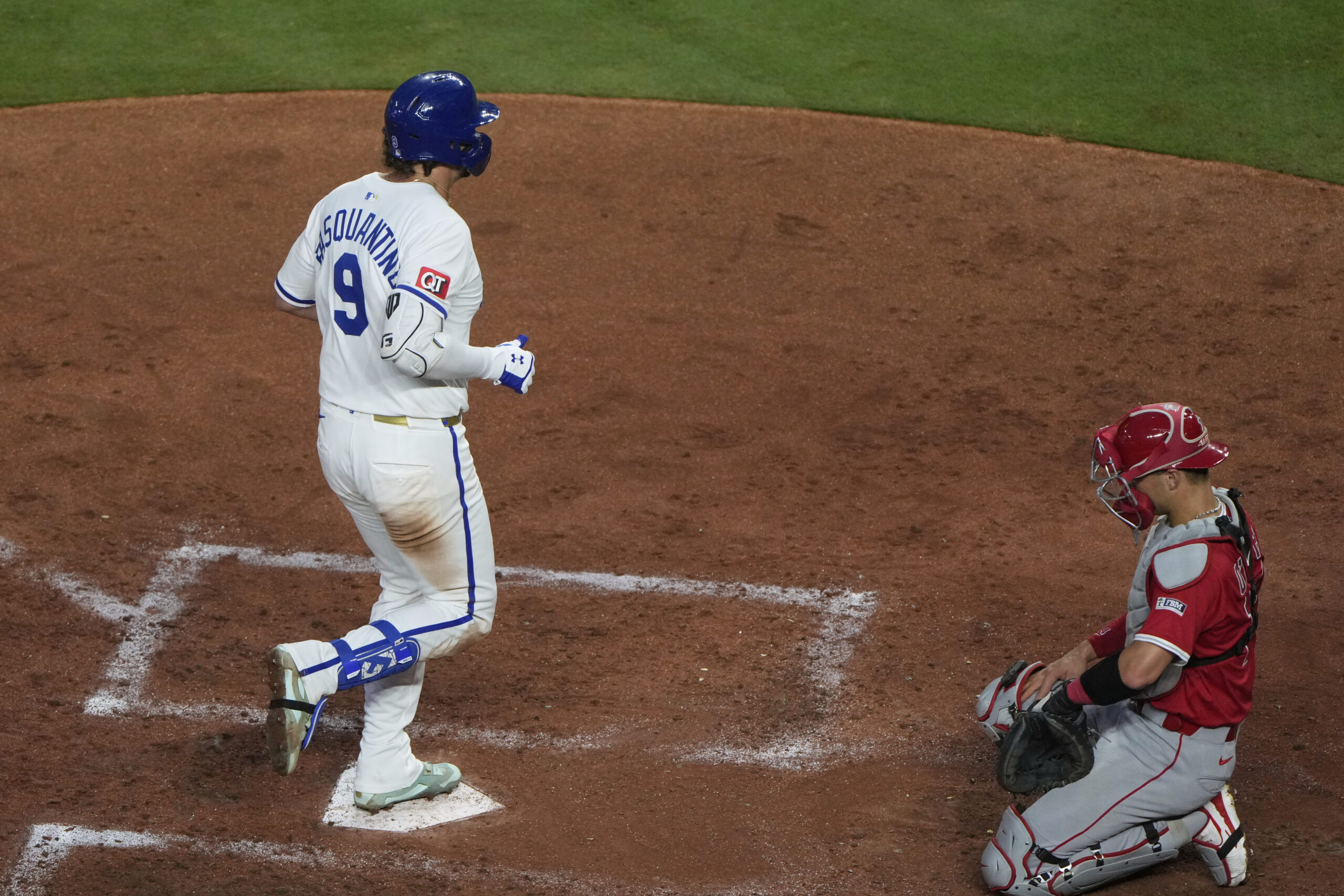 The Kansas City Royals’ Vinnie Pasquantino (9) crosses the plate...