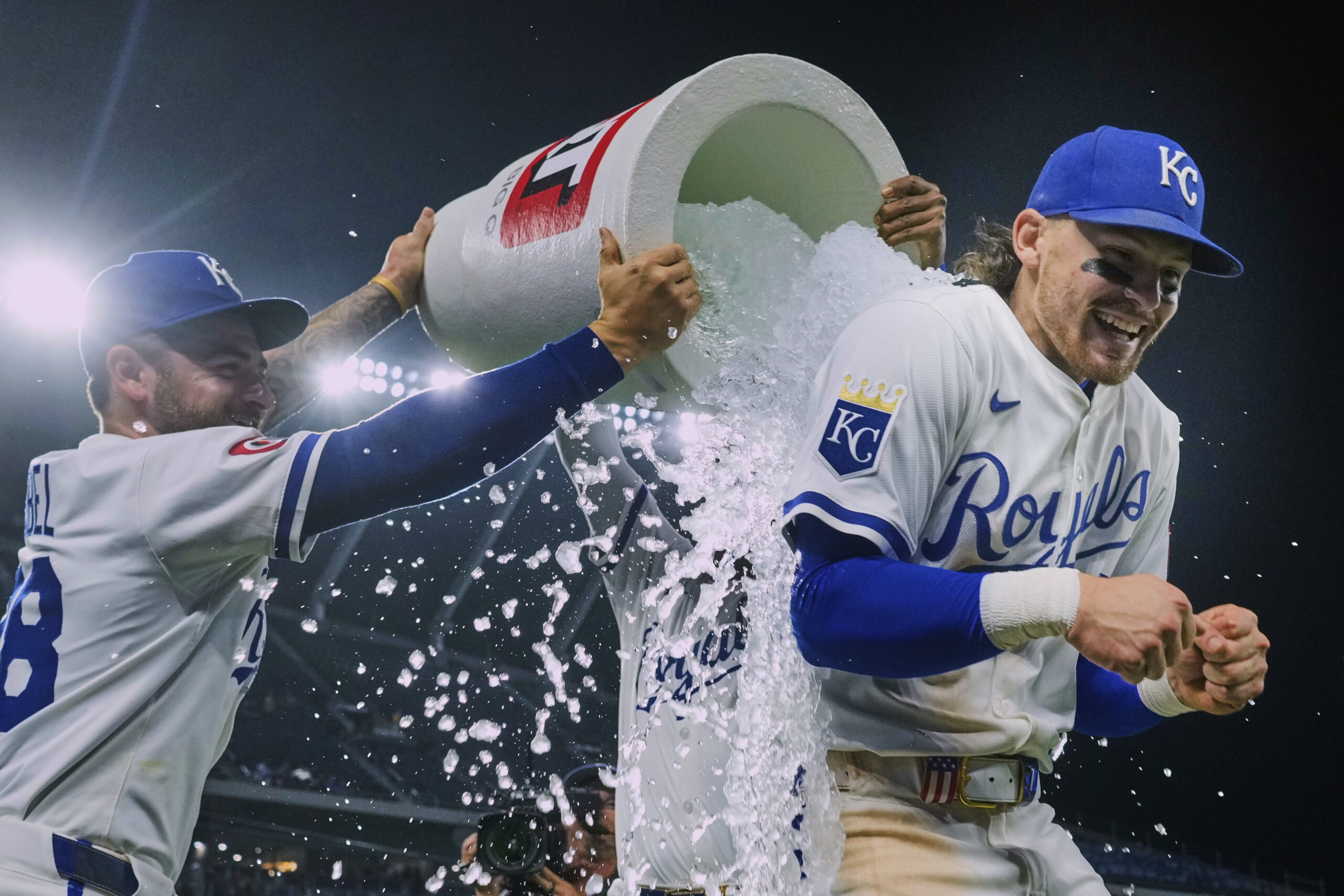 Kansas City Royals’ Bobby Witt Jr., right, is doused by...