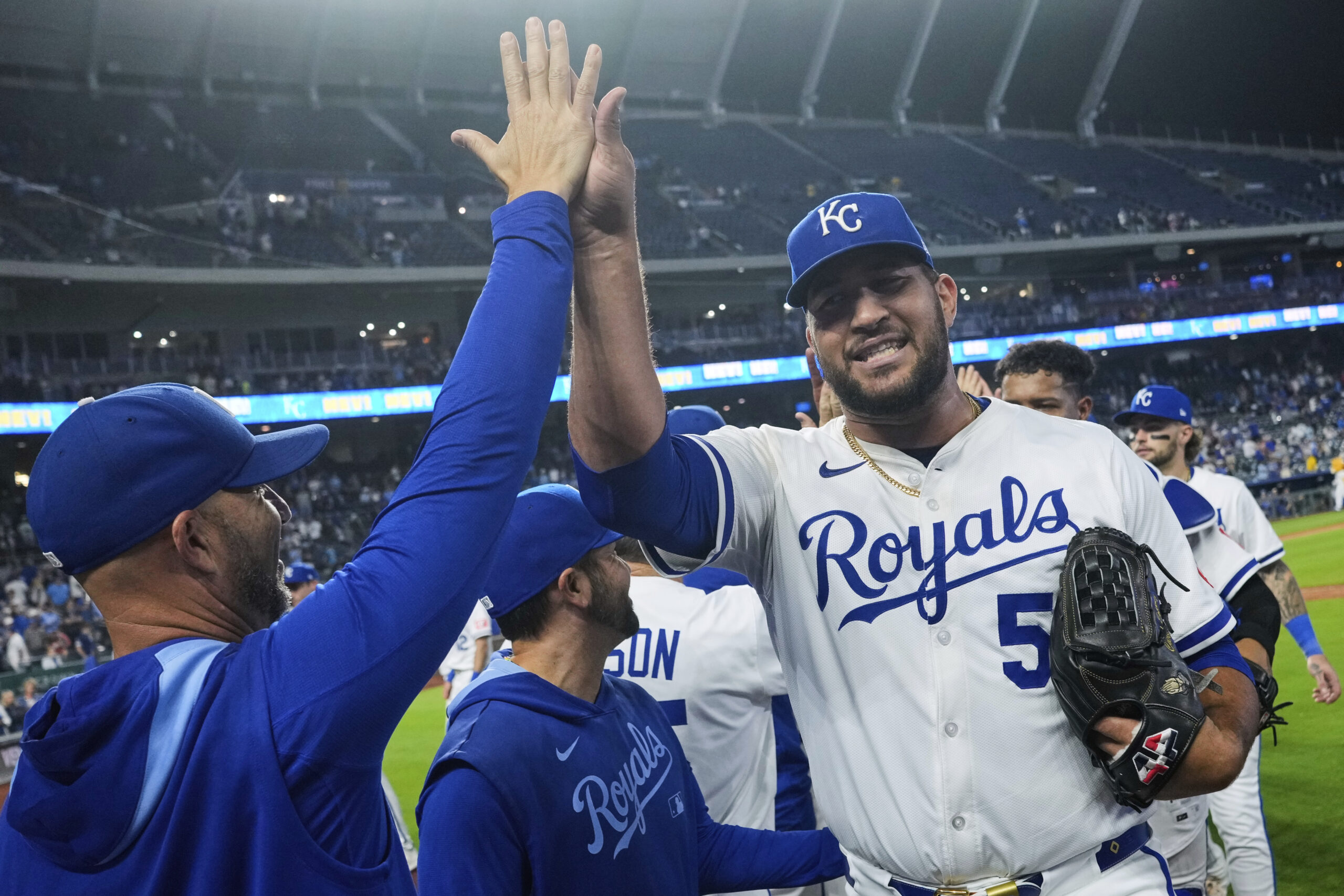 Kansas City Royals relief pitcher Carlos Estevez, right, celebrates with...
