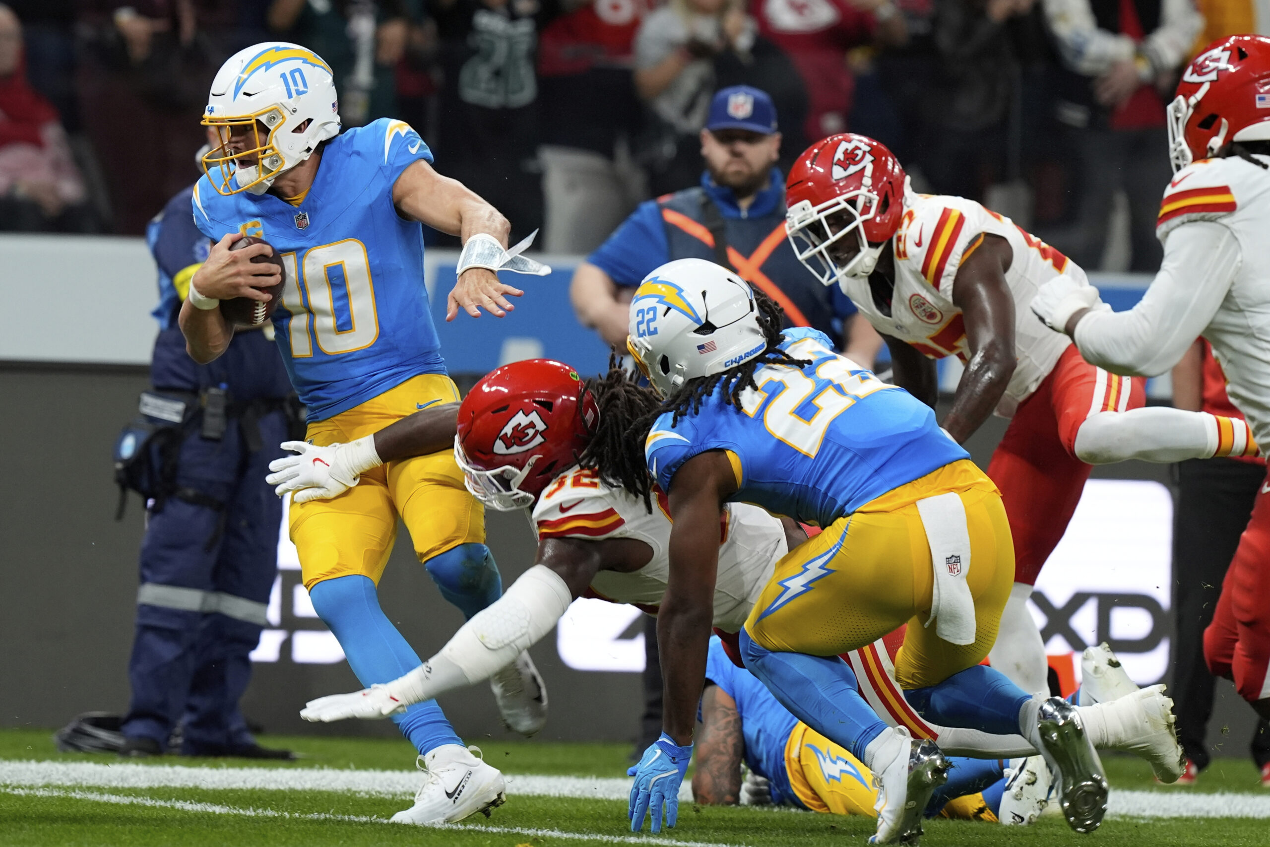 Chargers quarterback Justin Herbert runs against the Kansas City Chiefs...