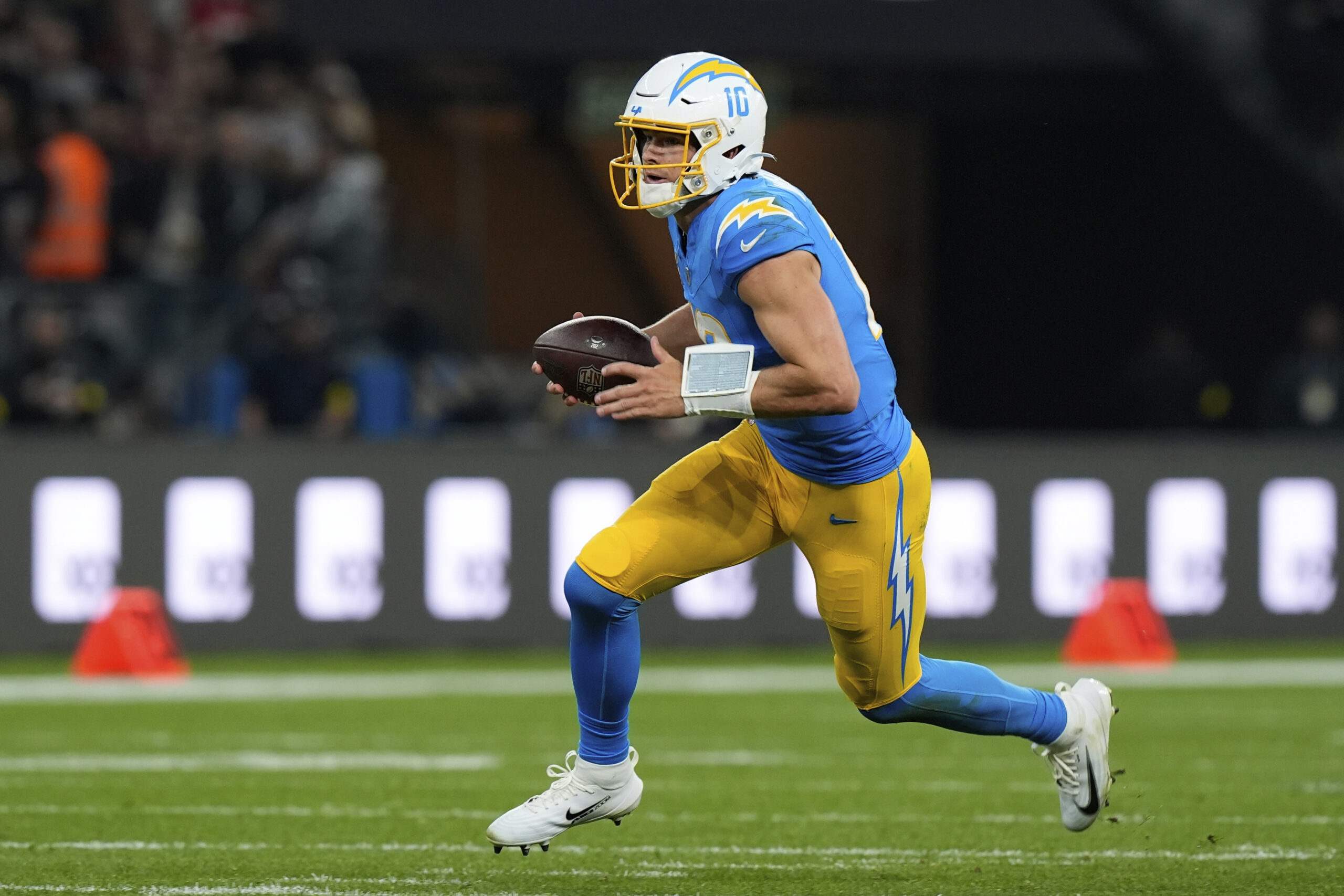 Chargers quarterback Justin Herbert runs against the Kansas City Chiefs...
