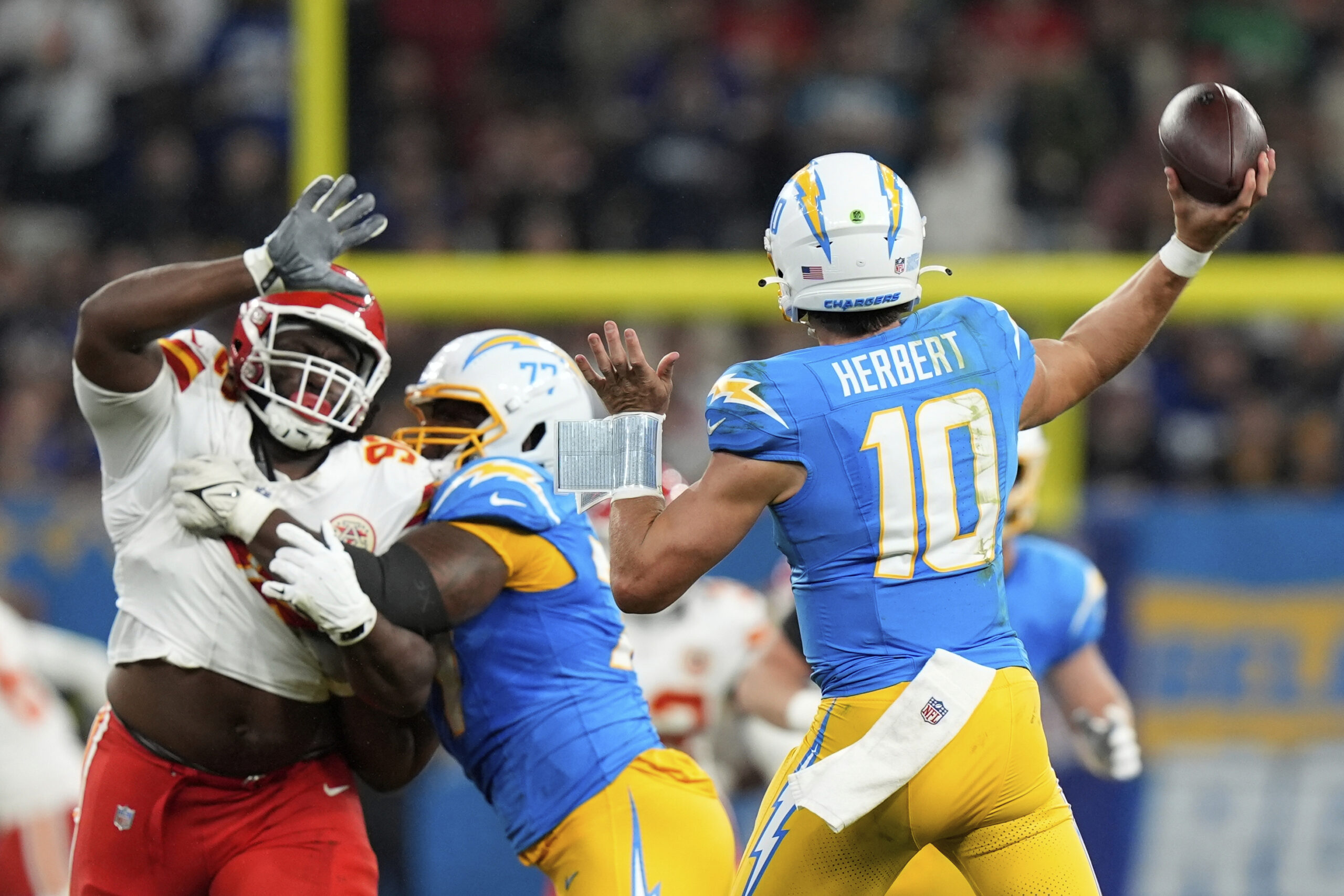 Chargers quarterback Justin Herbert passes against the Kansas City Chiefs...