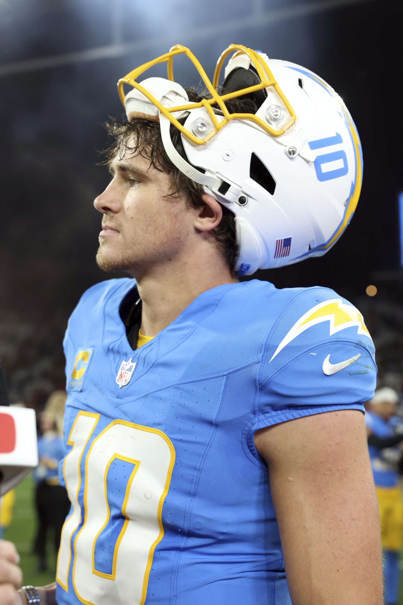 Chargers quarterback Justin Herbert (10) leaves the field after a...