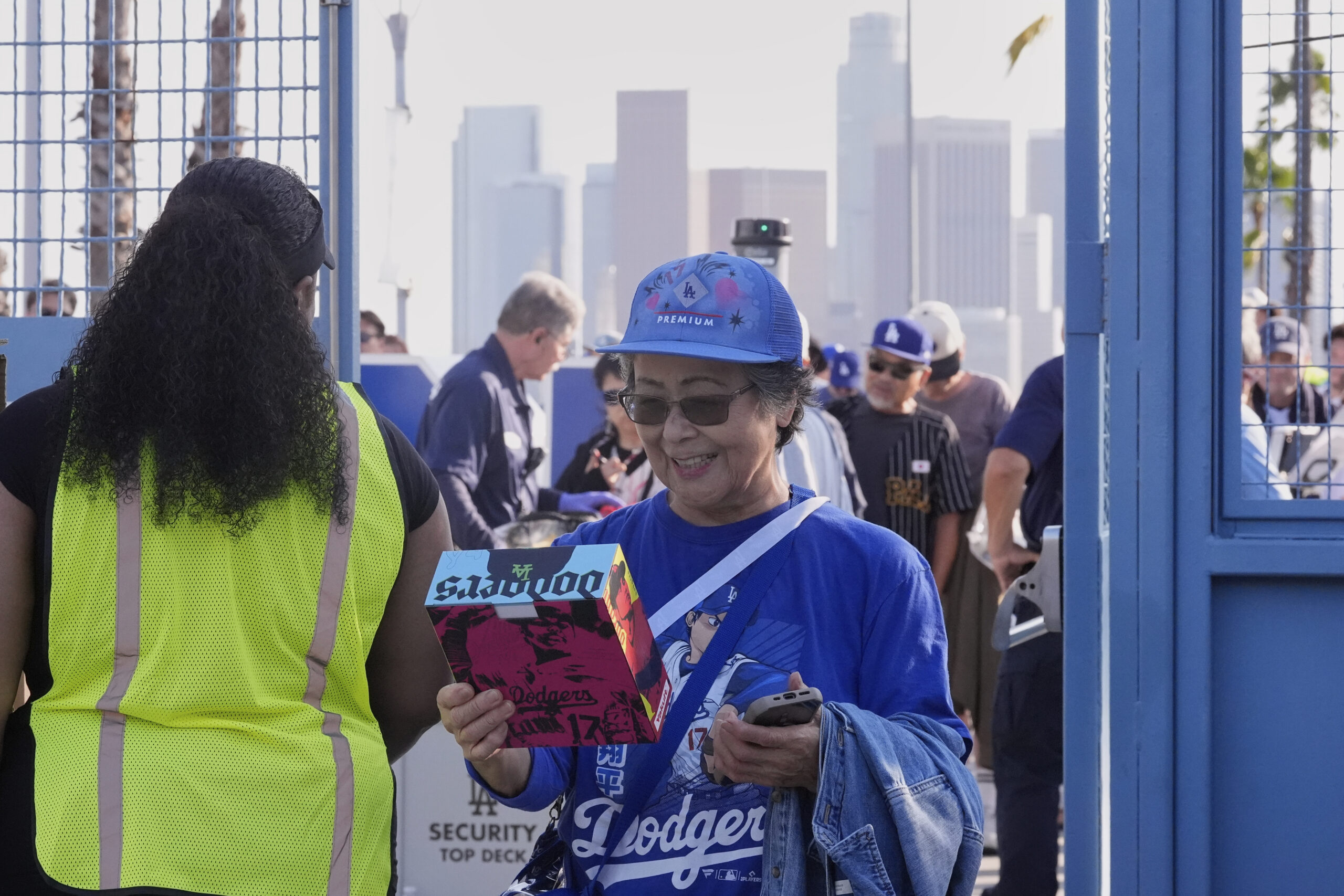Yoshiko Fujimoto looks at her Shohei Ohtani bobblehead as she...