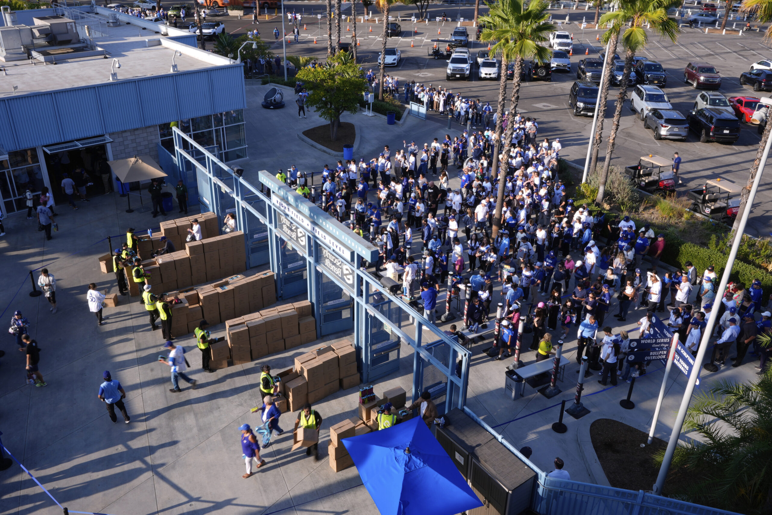 Fans receive their Shohei Ohtani bobbleheads as they enter Dodger...