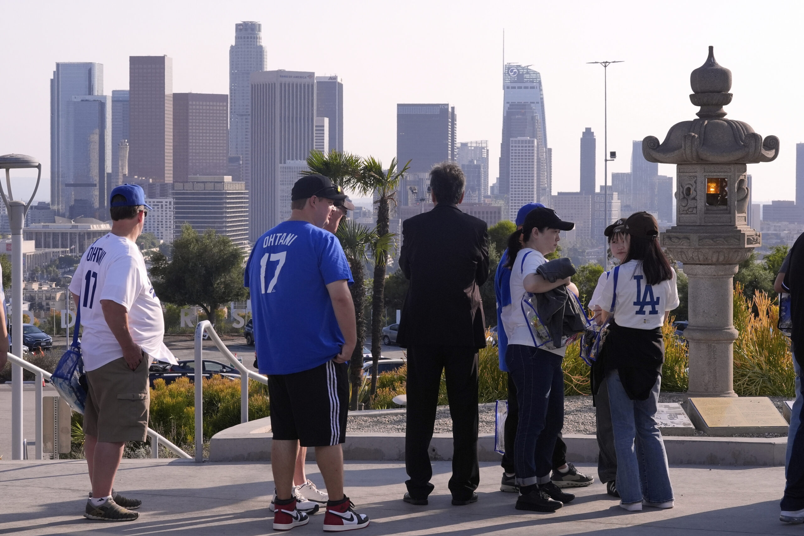 Fans line up at the entrance to Dodger Stadium to...