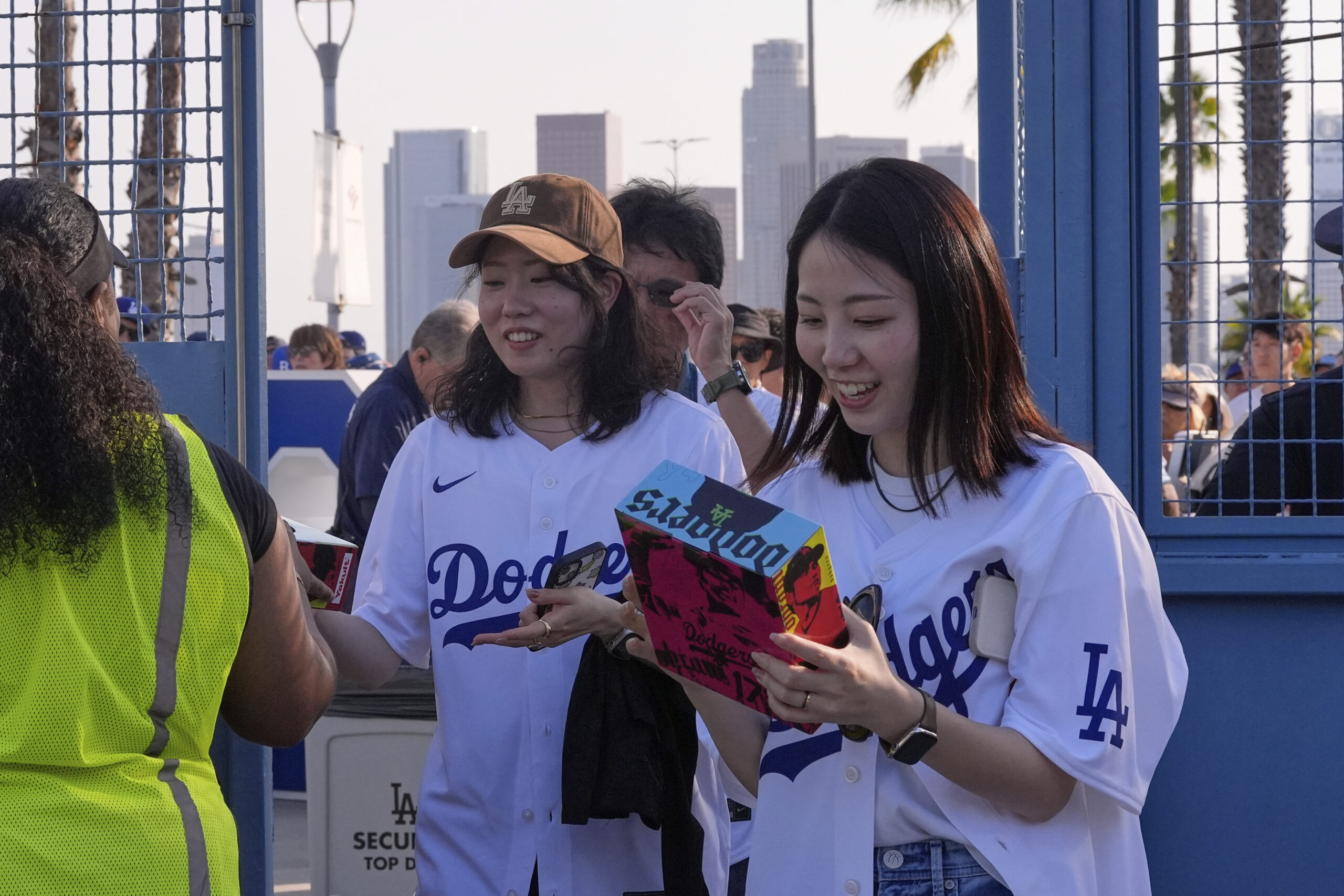 Fans receive their Shohei Ohtani bobbleheads as they enter Dodger...