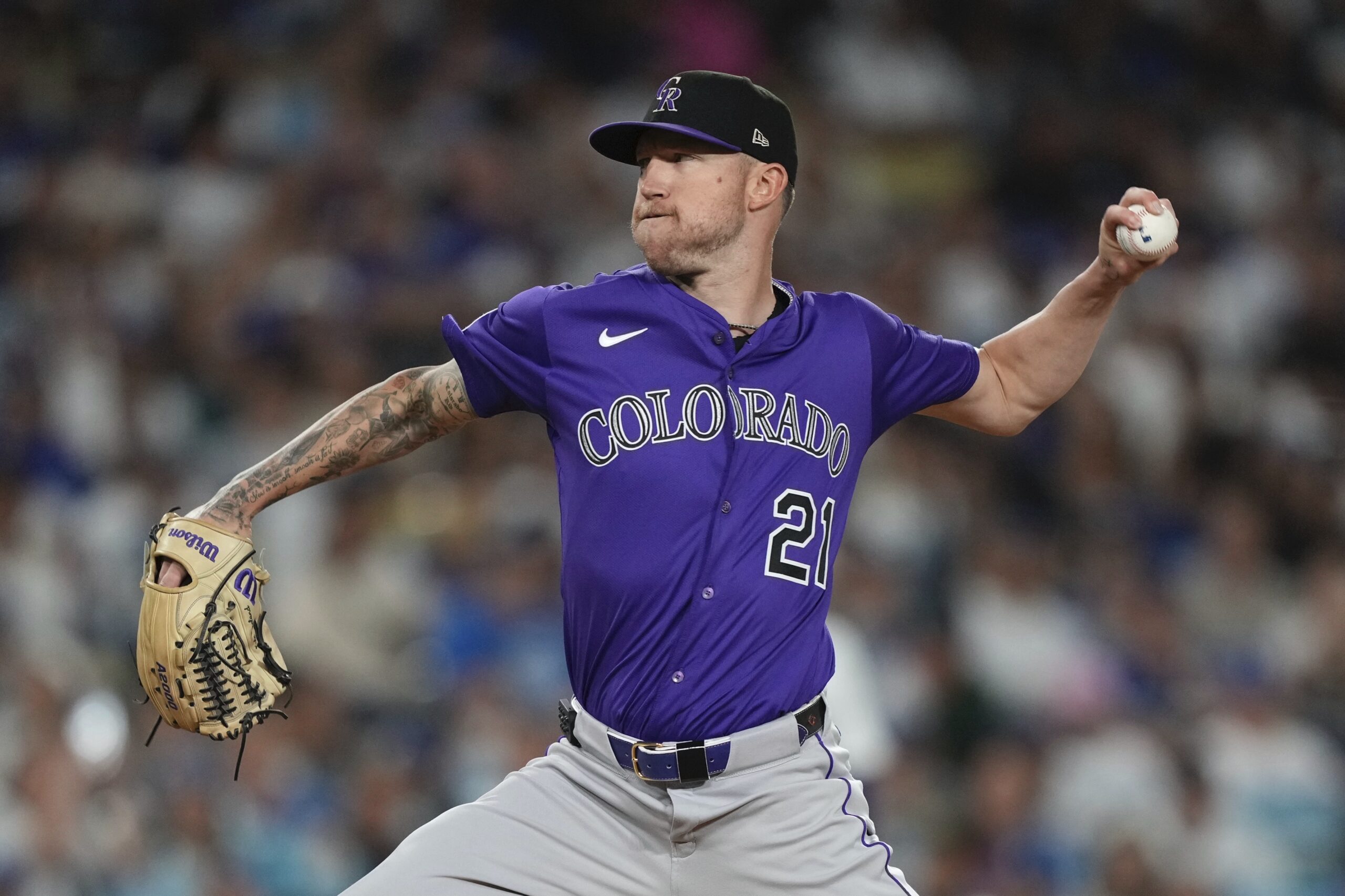 Colorado Rockies starting pitcher Kyle Freeland throws to the plate...