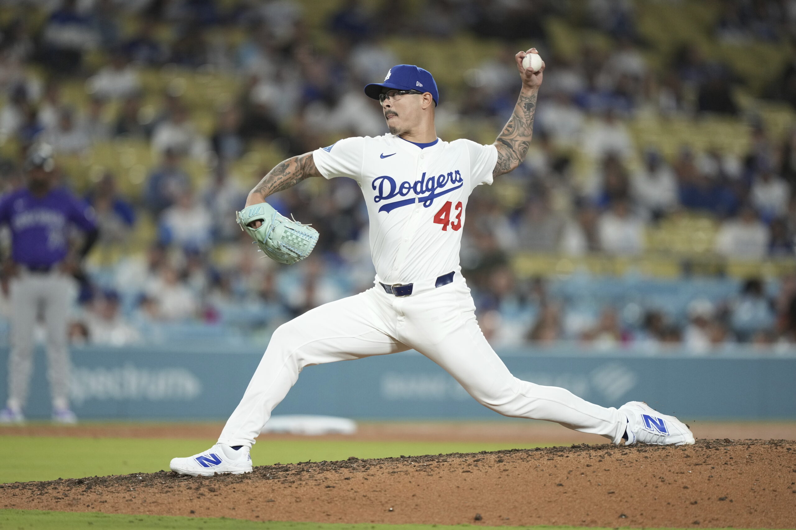 Dodgers relief pitcher Anthony Banda throws to the plate during...