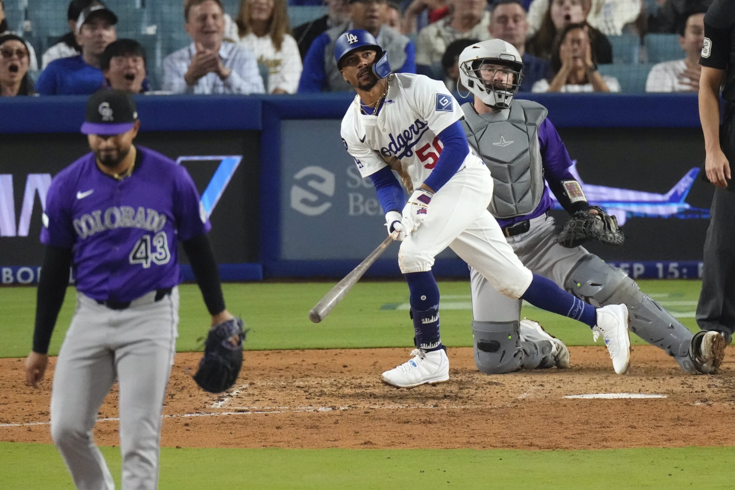 The Dodgers’ Mookie Betts begins to run the bases as...