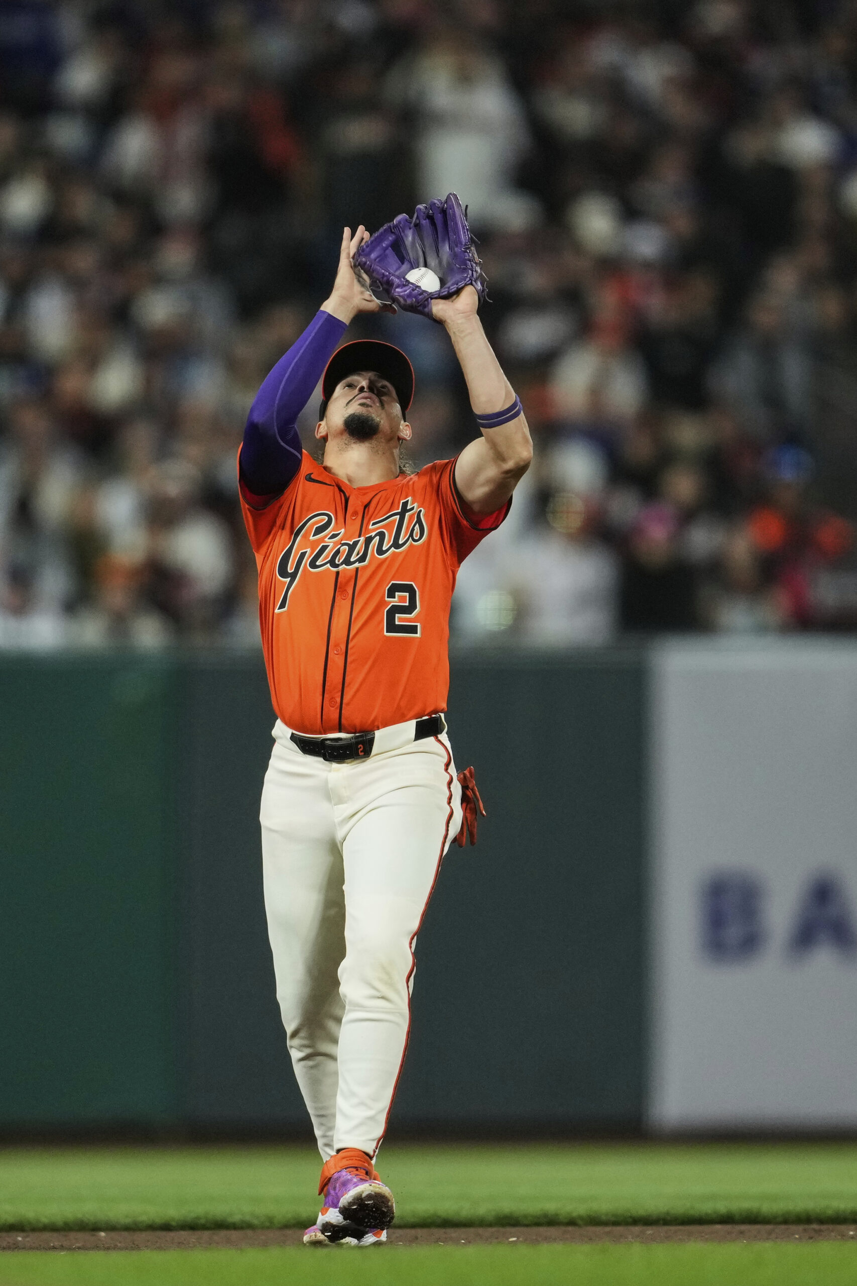 San Francisco Giants shortstop Willy Adames catches a pop-up hit...