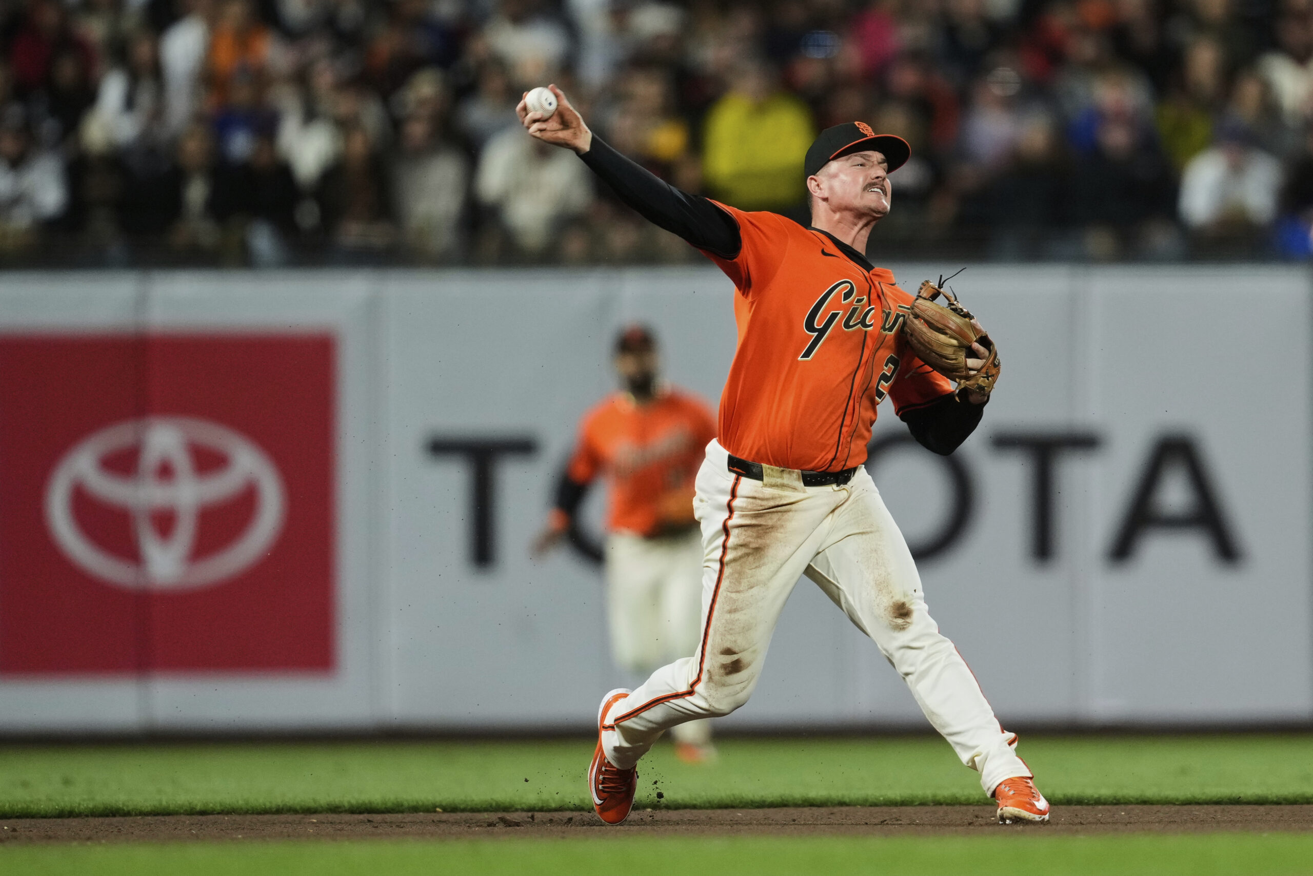 San Francisco Giants third baseman Matt Chapman throws to first...