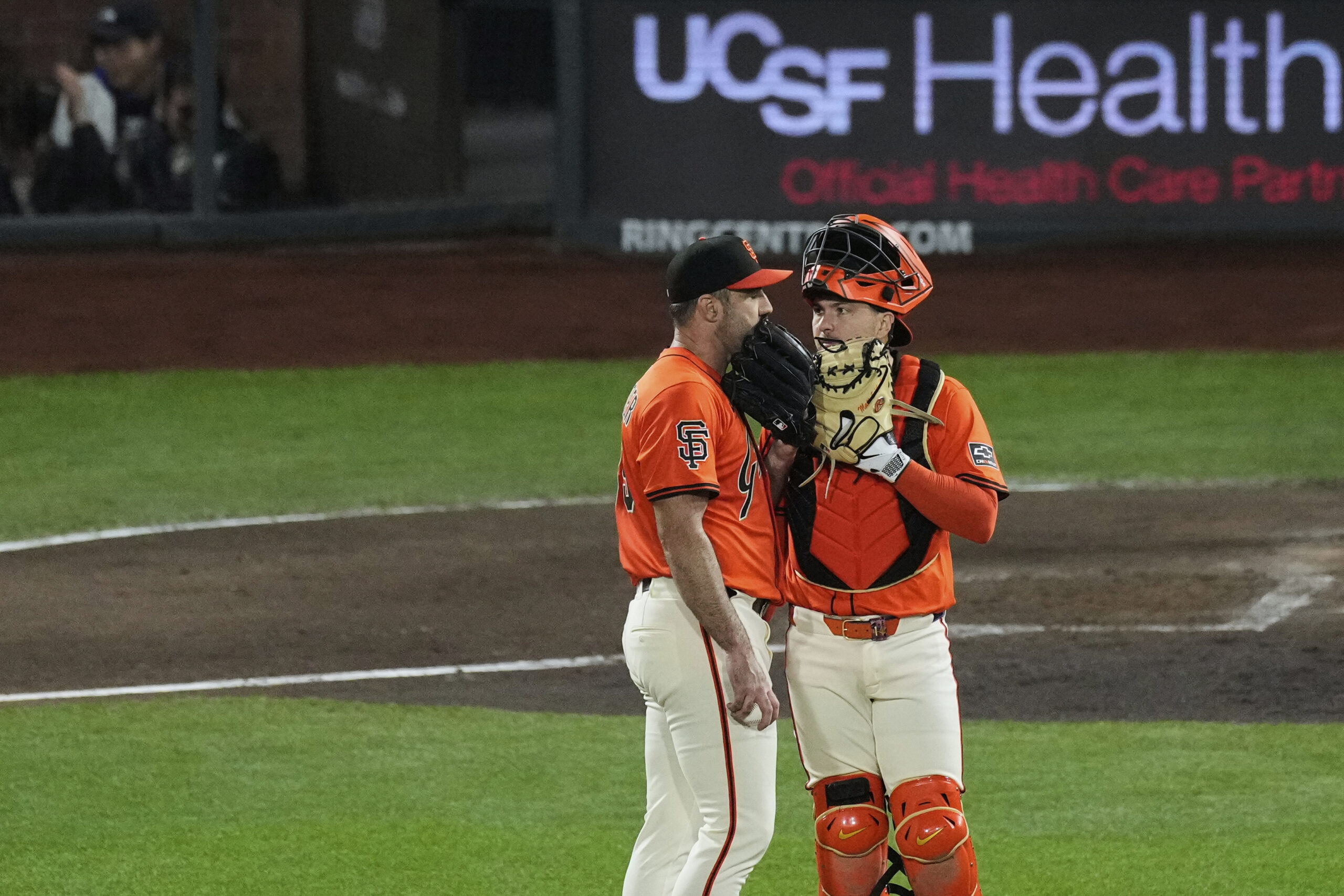San Francisco Giants starting pitcher Justin Verlander, left, talks with...