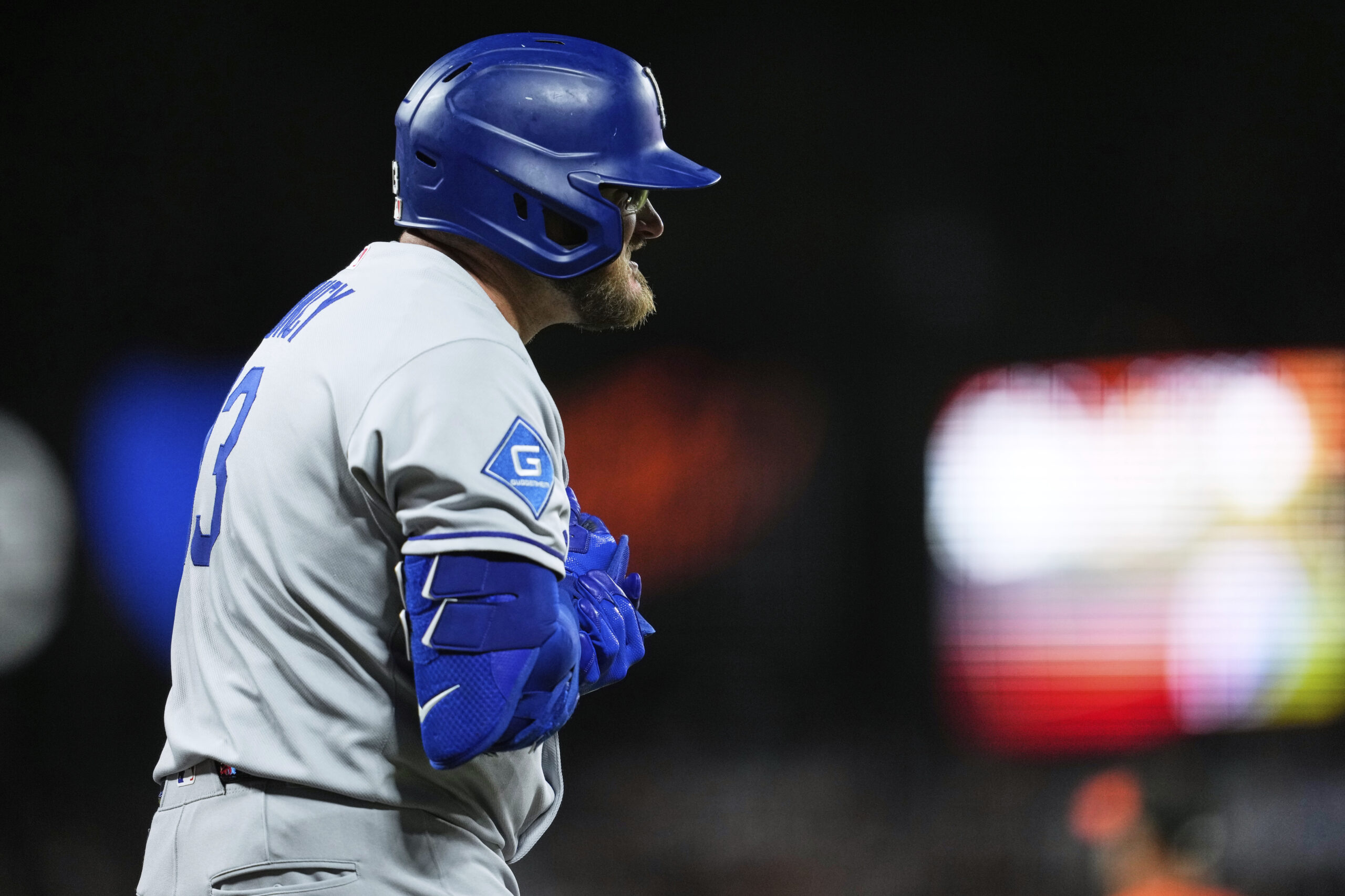 The Dodgers’ Max Muncy reacts after being hit on the...
