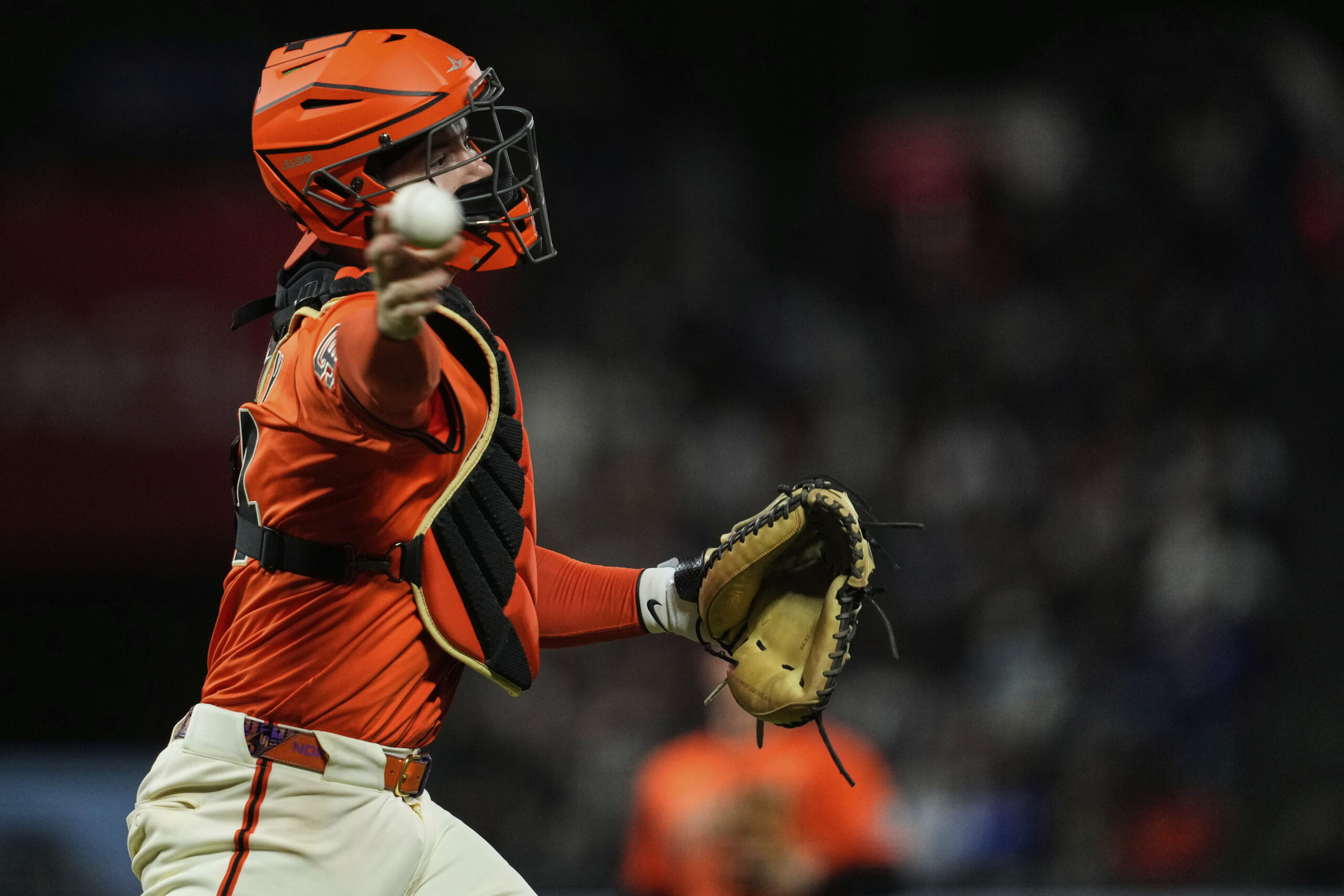 San Francisco Giants catcher Patrick Bailey throws to first for...