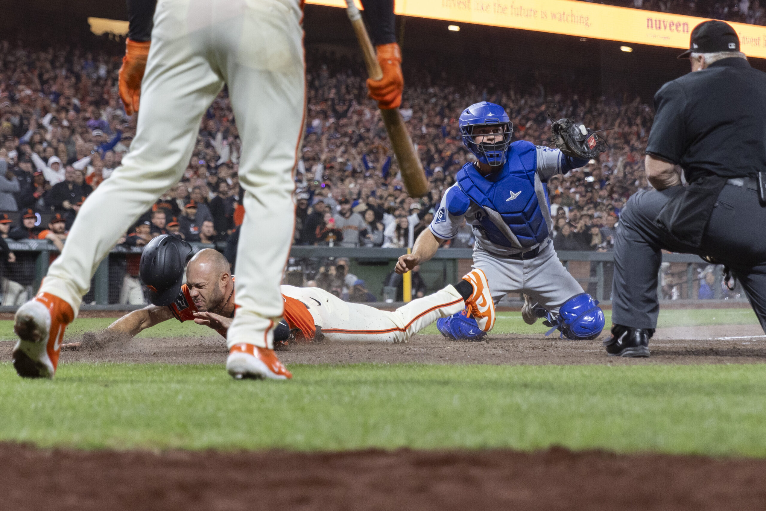 San Francisco Giants outfielder Grant McCray, left, is tagged out...