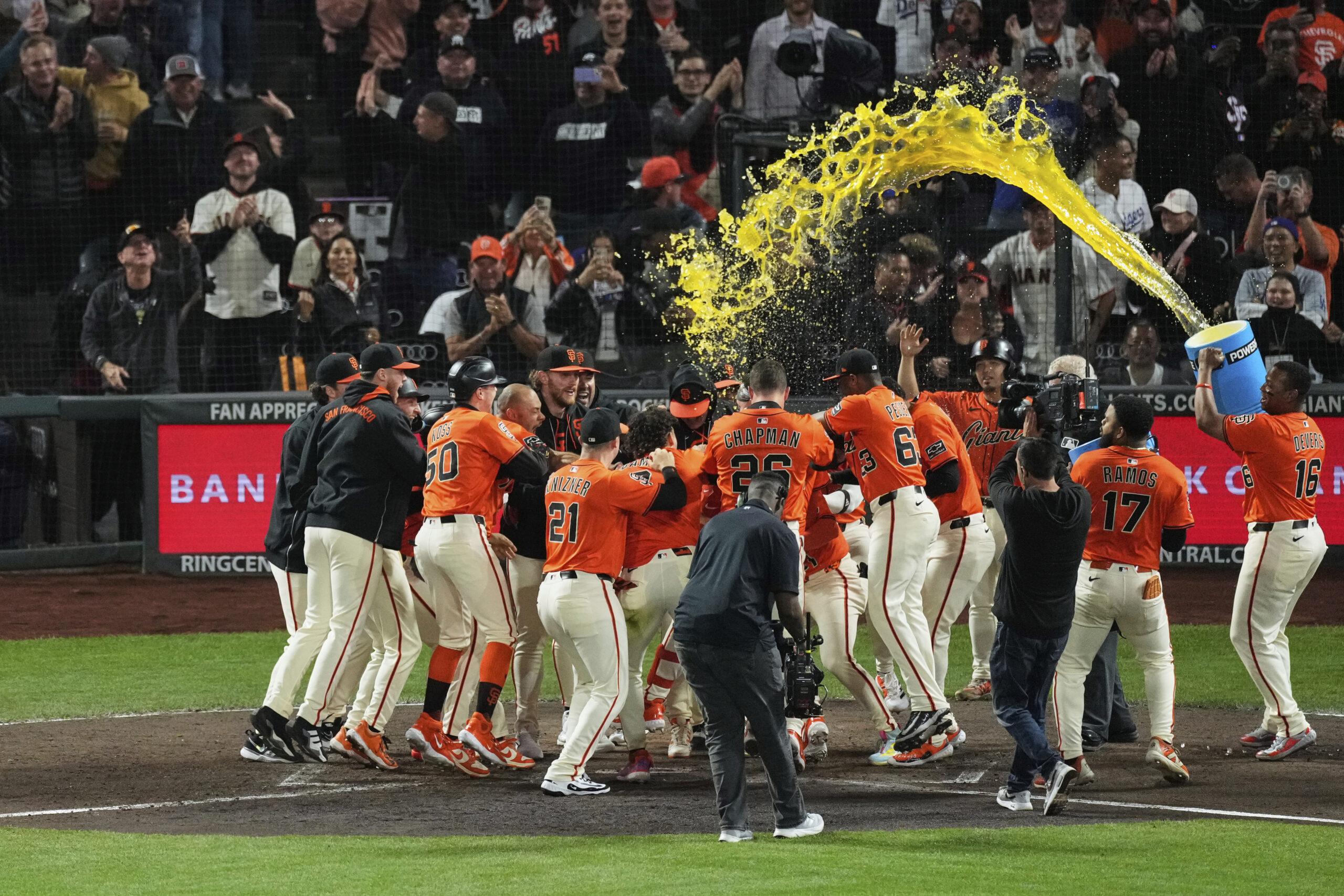 The San Francisco Giants’ Patrick Bailey is mobbed and doused...
