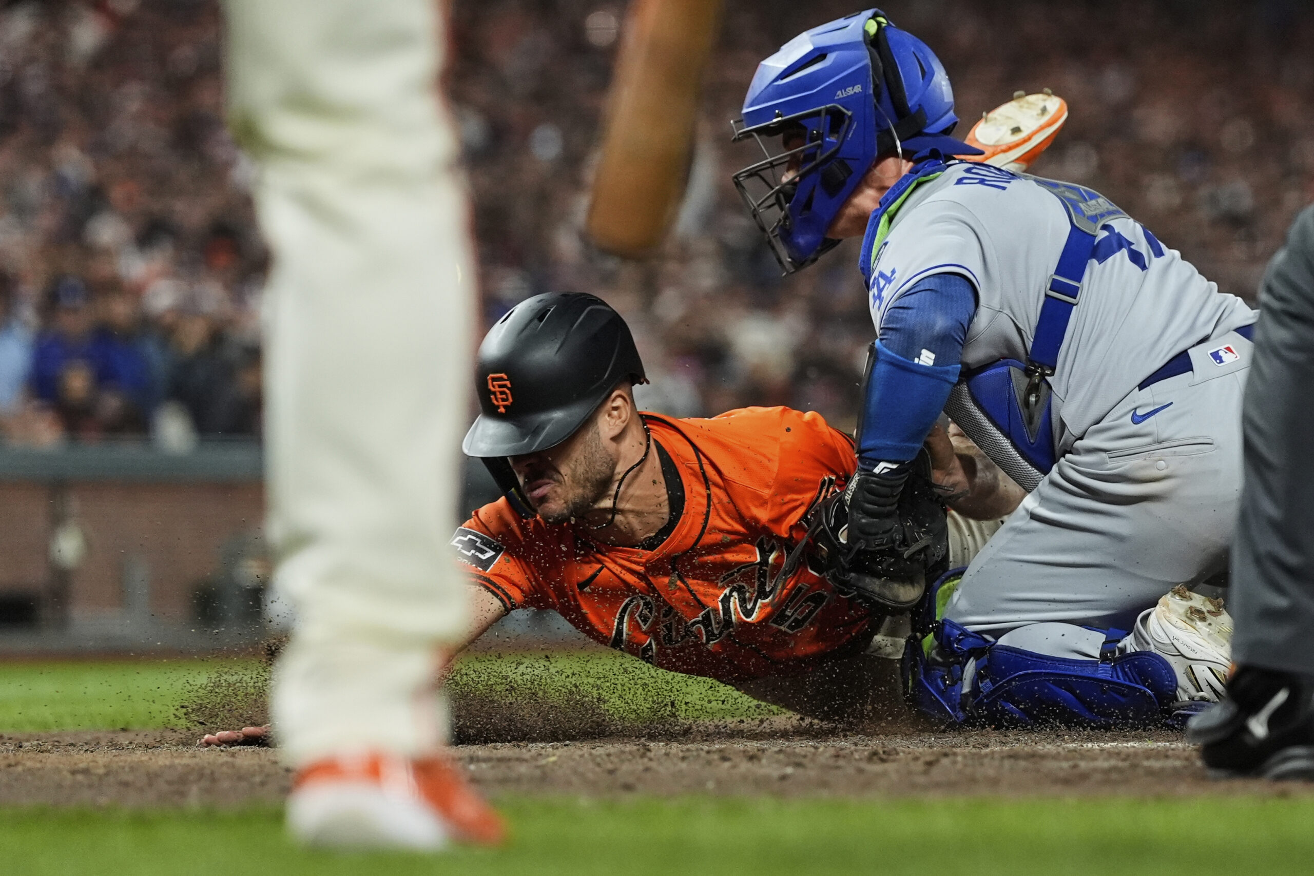 The San Francisco Giants’ Grant McCray, center, is tagged out...