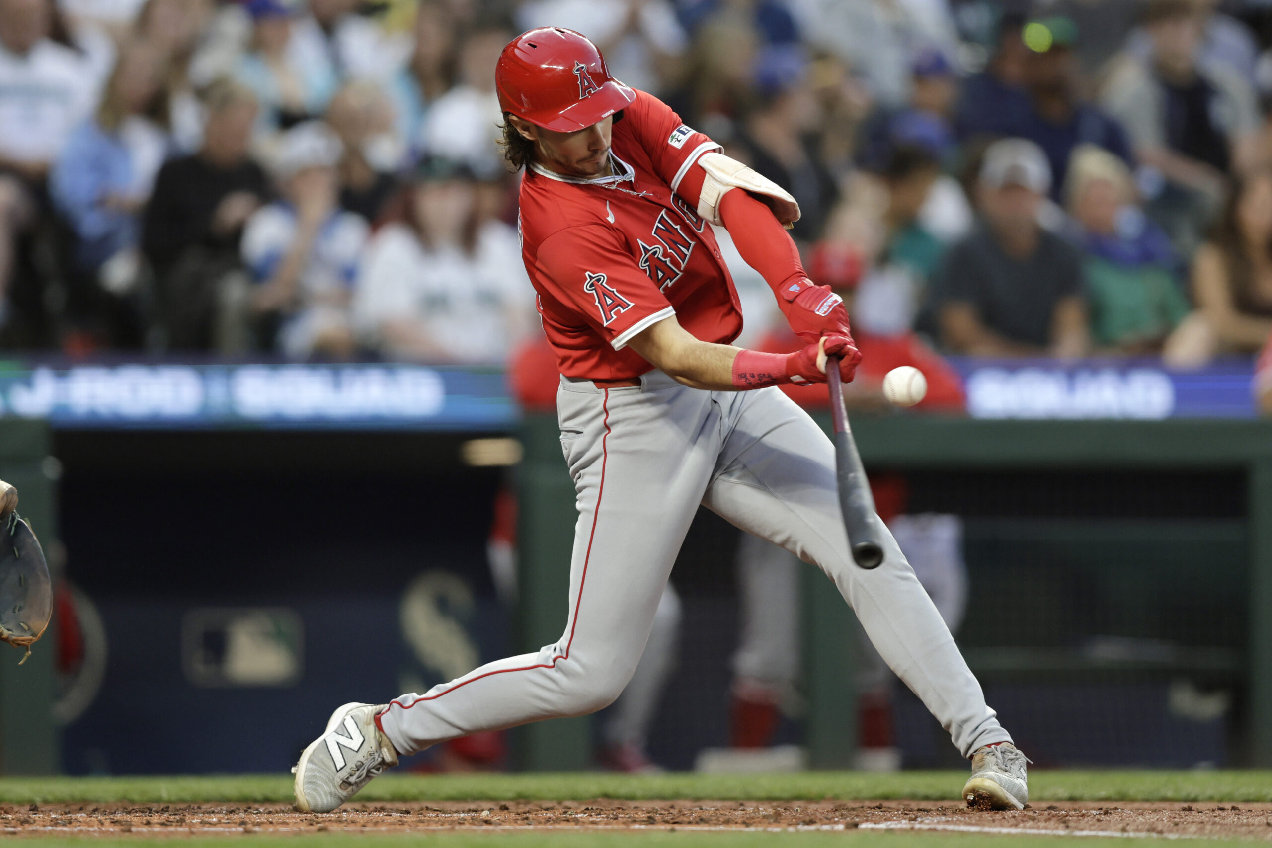 Angels’ Bryce Teodosio singles in a run against the Seattle...