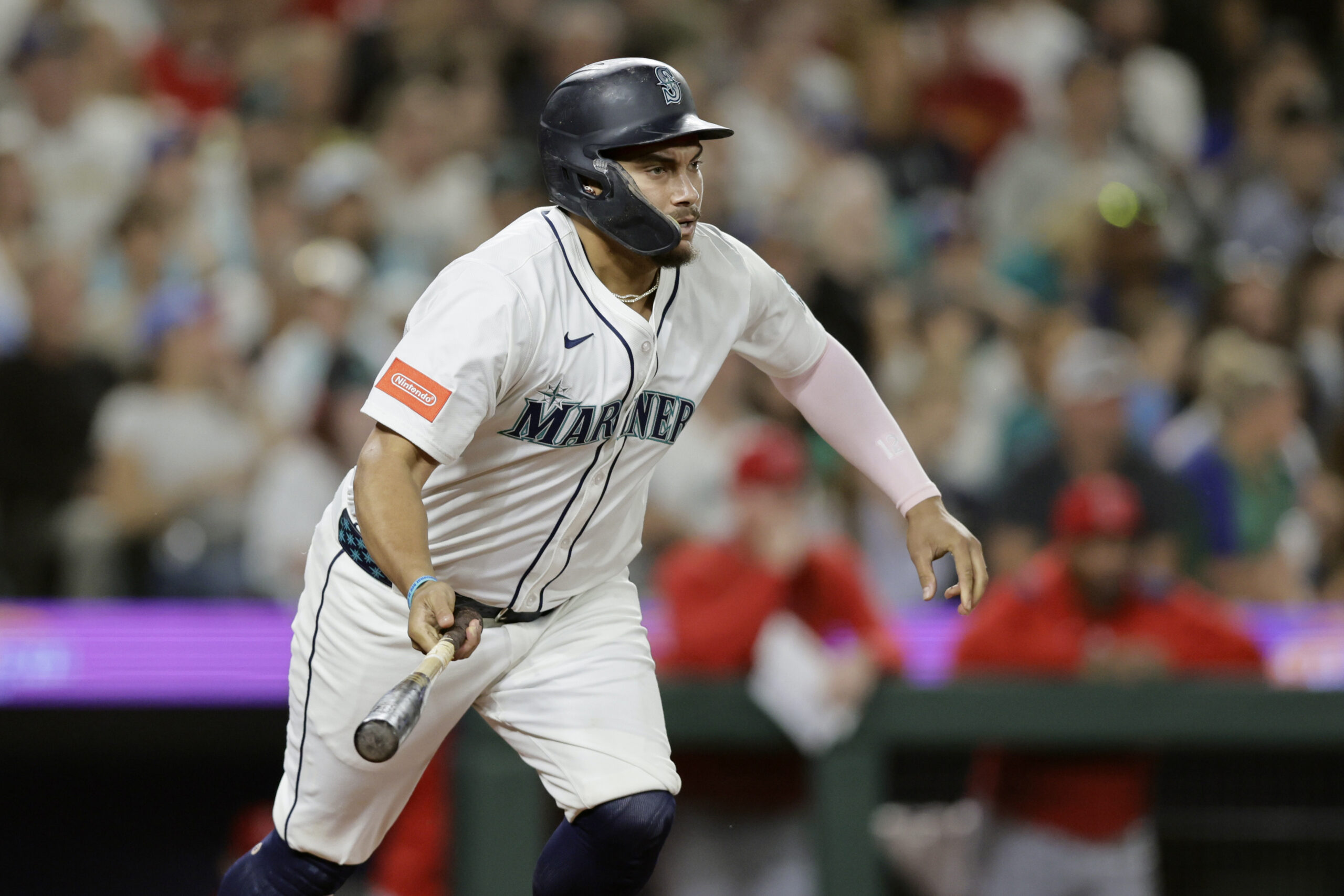 Seattle Mariners’ Josh Naylor hits a two-RBI single against the...