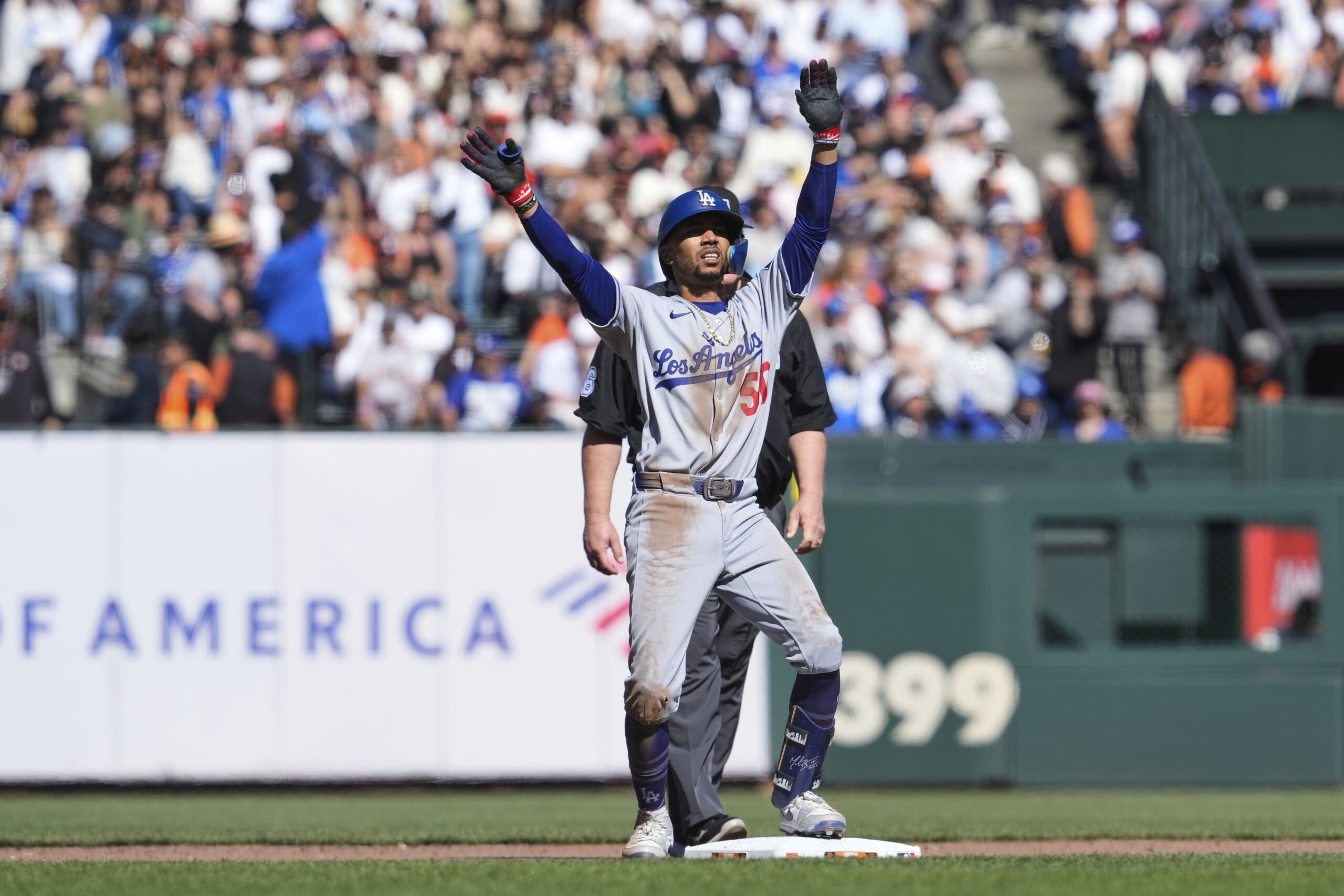 Dodgers’ Mookie Betts reacts after hitting a double during the...