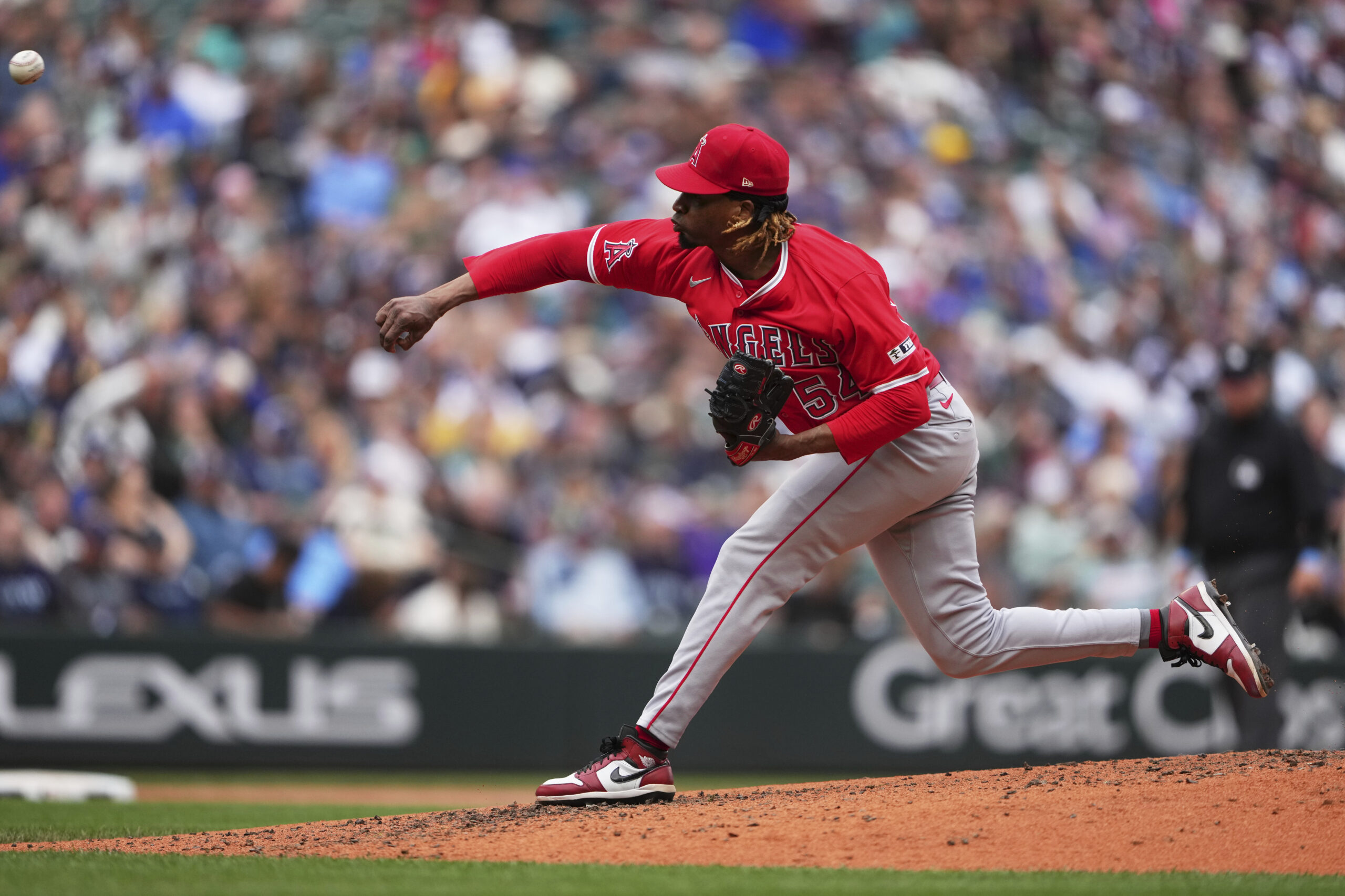Angels relief pitcher Jose Ureña throws against the Seattle Mariners...