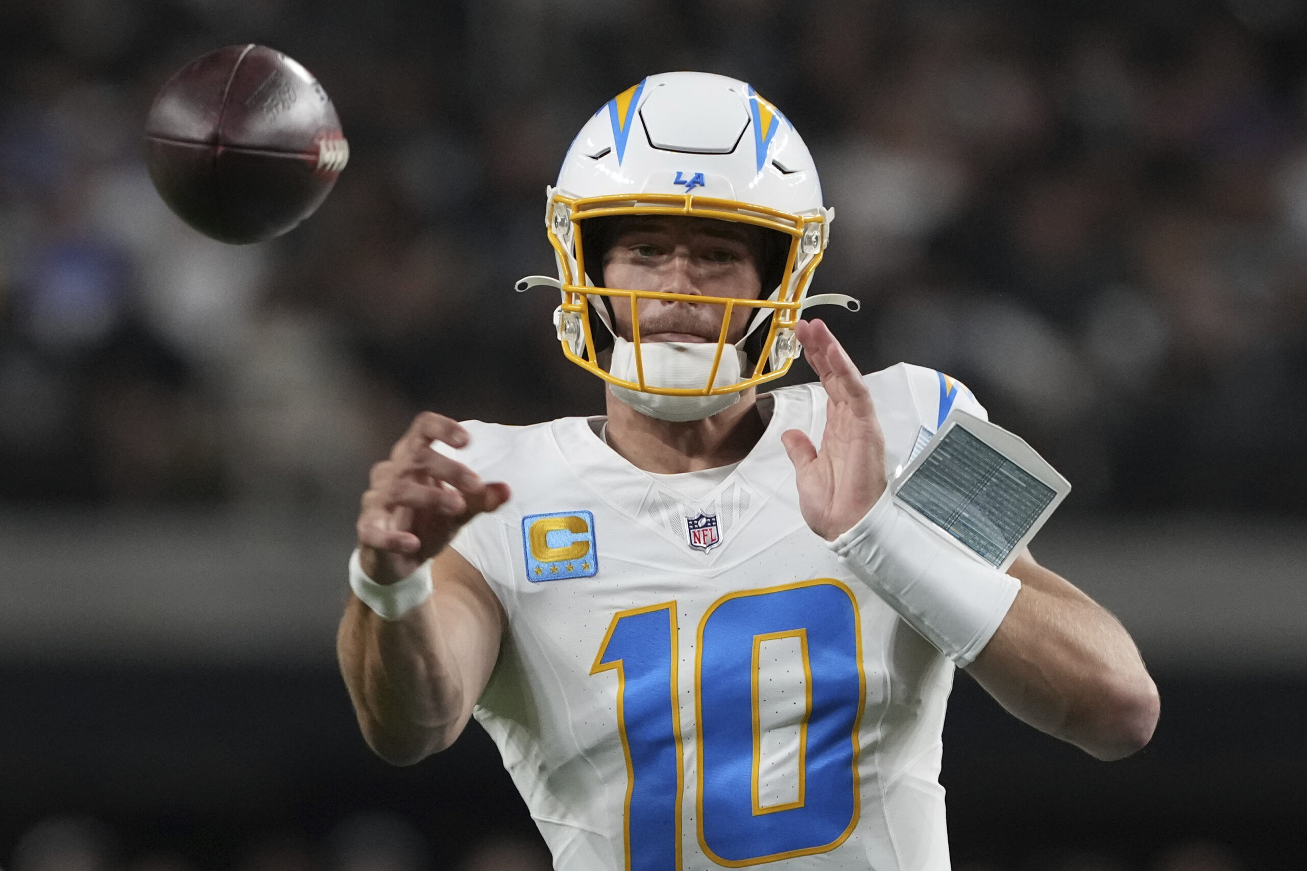 Chargers quarterback Justin Herbert throws a pass against the Las...