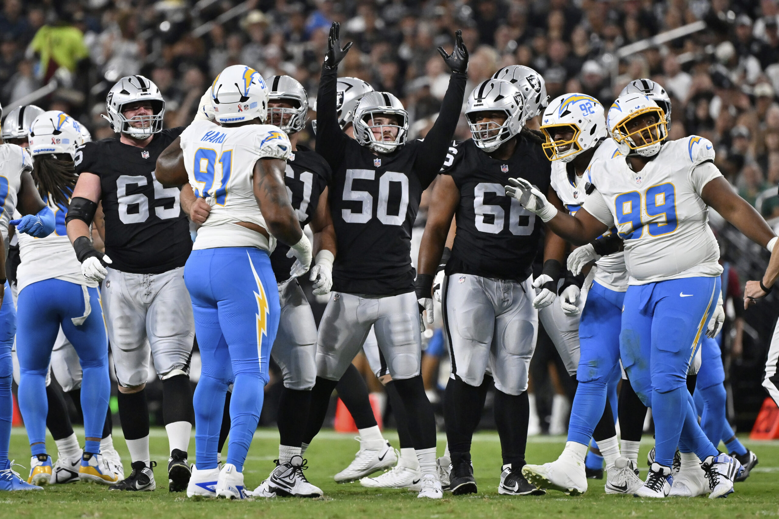 Las Vegas Raiders long snapper Jacob Bobenmoyer (50) reacts after...
