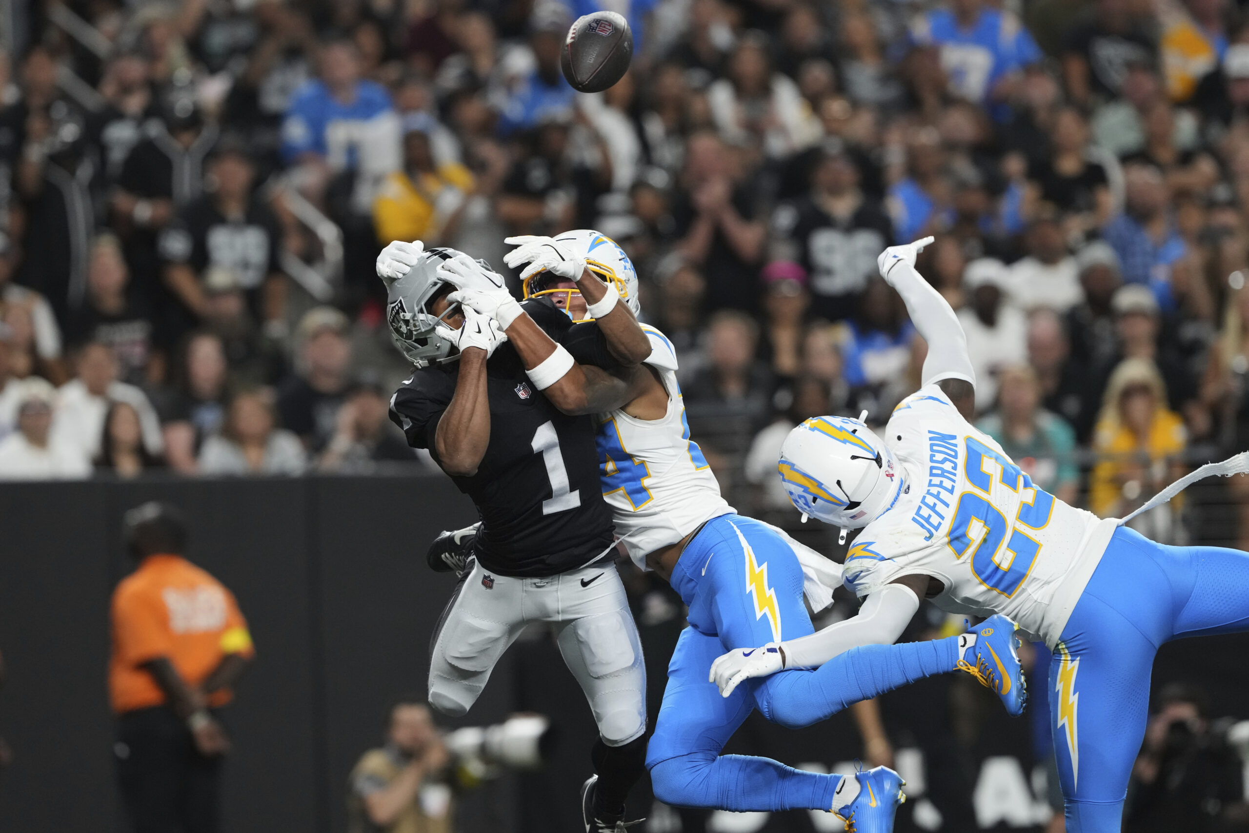 Chargers cornerback Benjamin St-Juste (24) breaks up a pass intended...