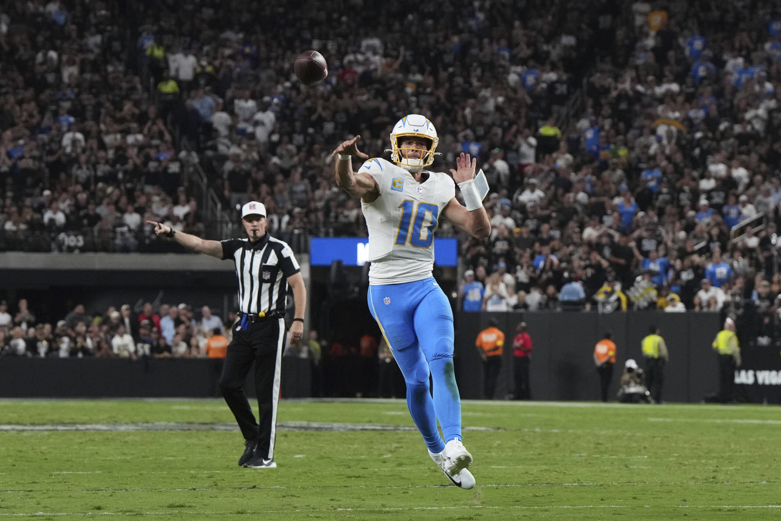 Chargers quarterback Justin Herbert throws against the the Las Vegas...