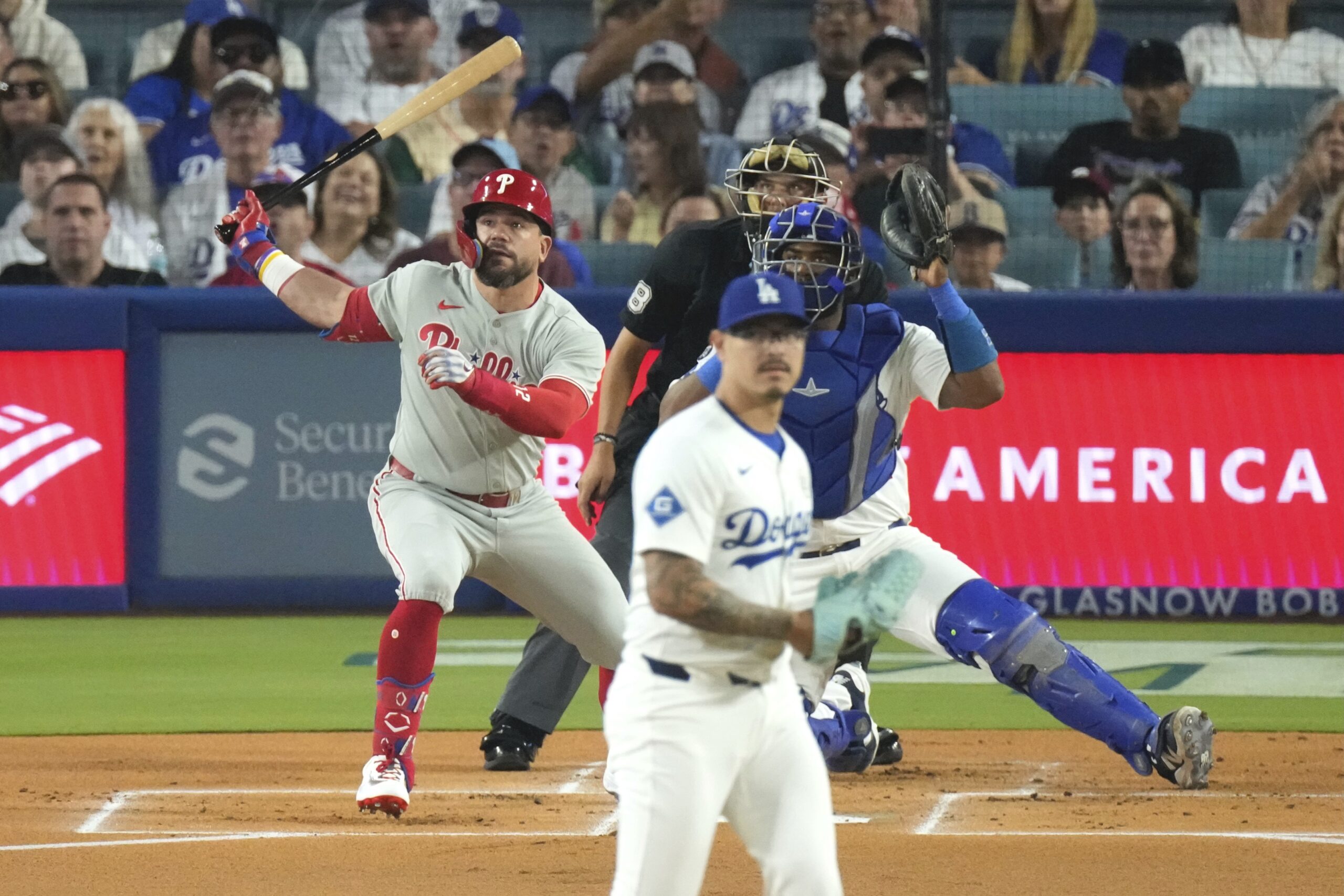 The Philadelphia Phillies’ Kyle Schwarber, watches the flight of his...