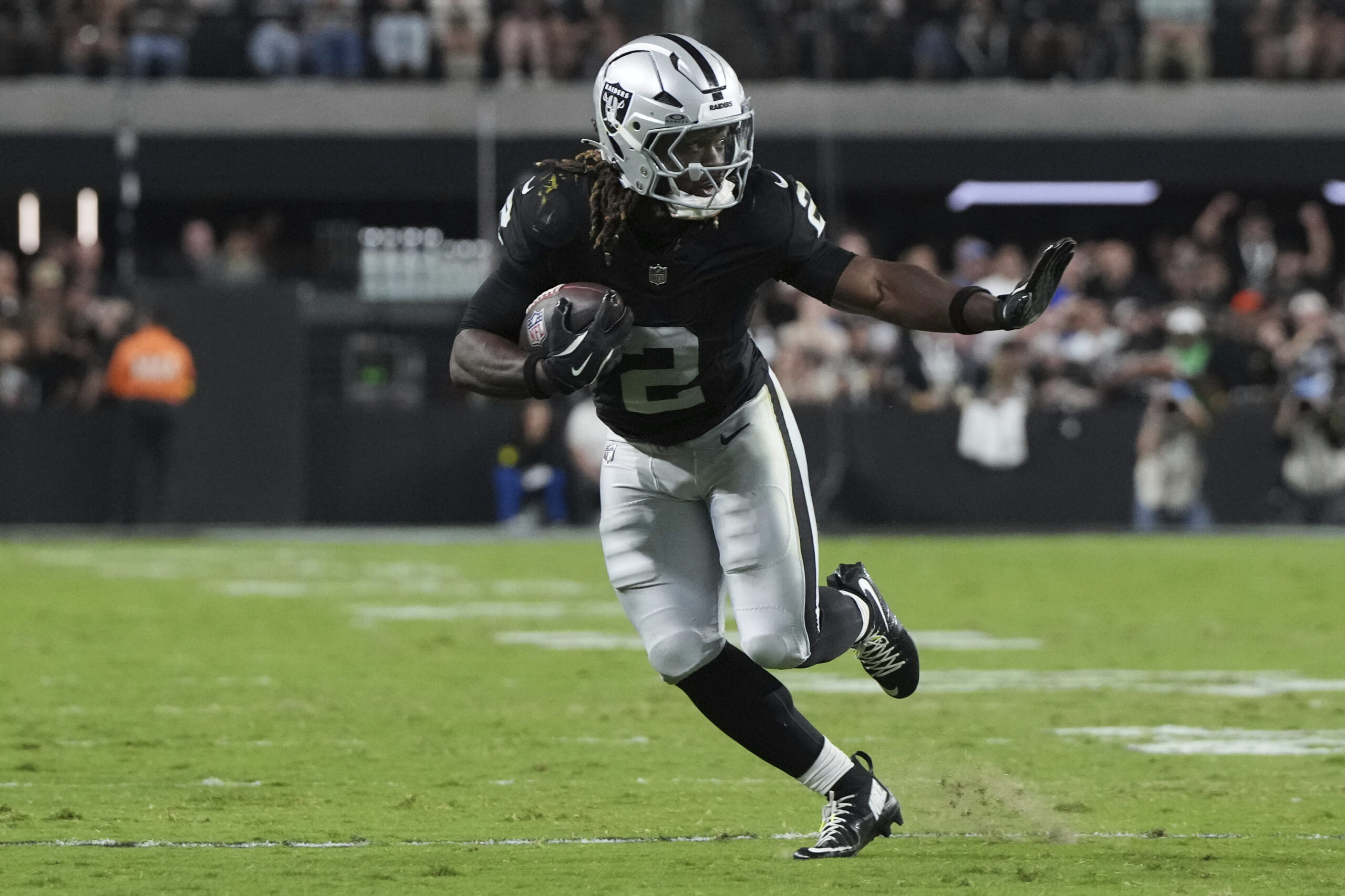 Las Vegas Raiders running back Ashton Jeanty runs with the...