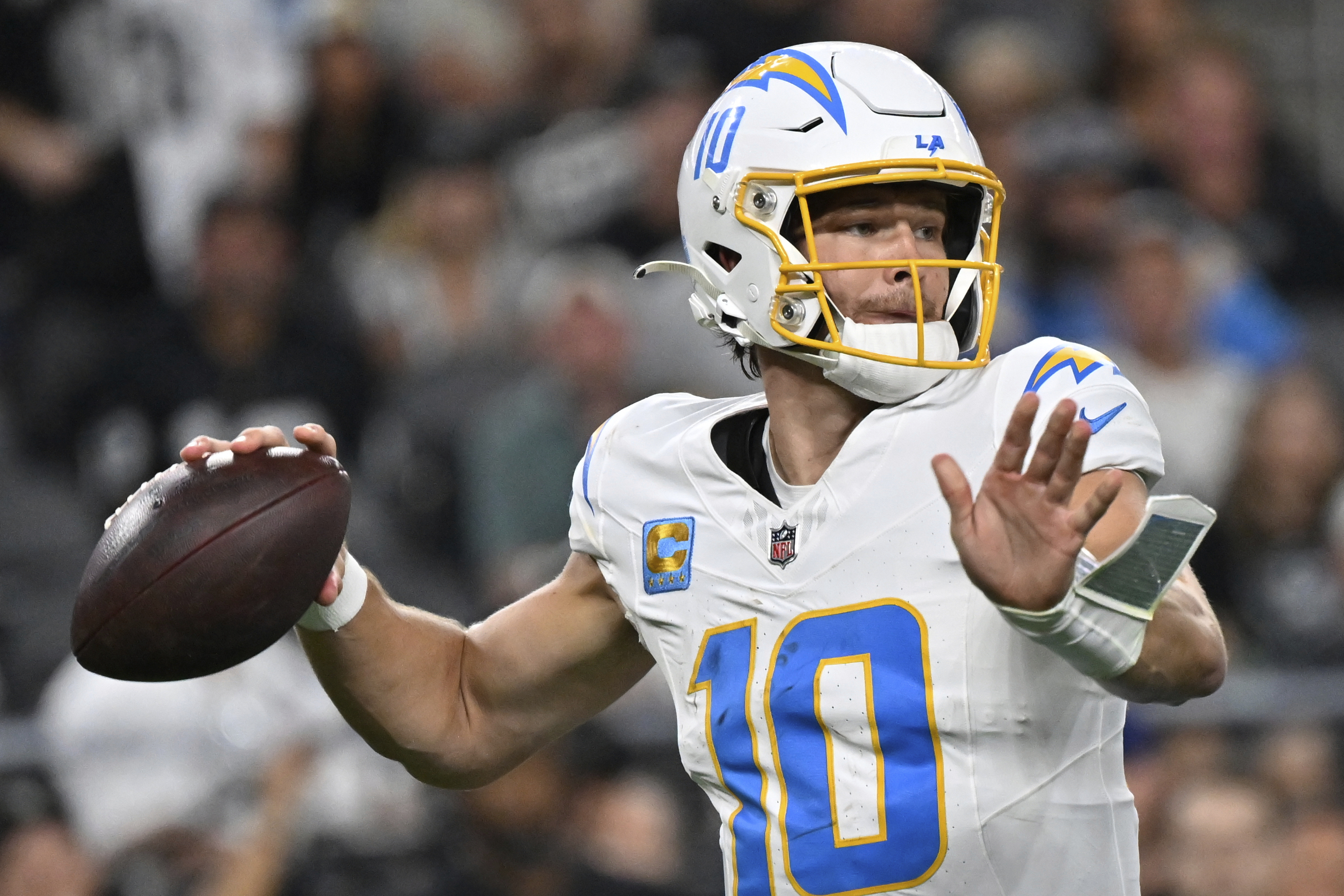 Chargers quarterback Justin Herbert throws a pass against the Las...
