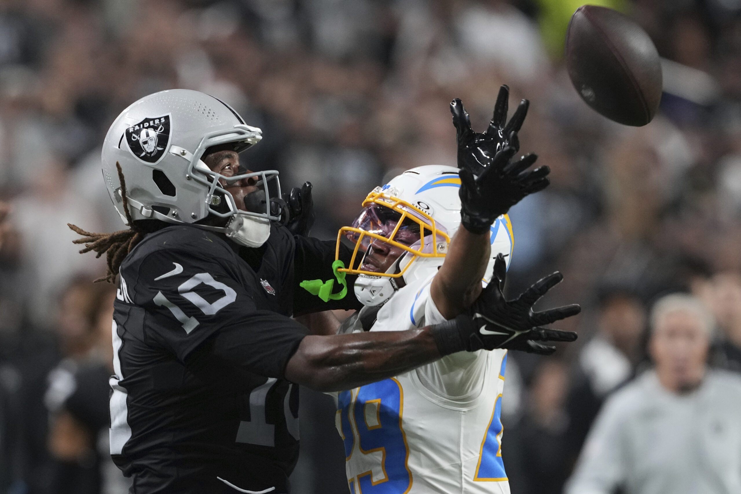 Chargers cornerback Tarheeb Still (29) breaks up a pass intended...