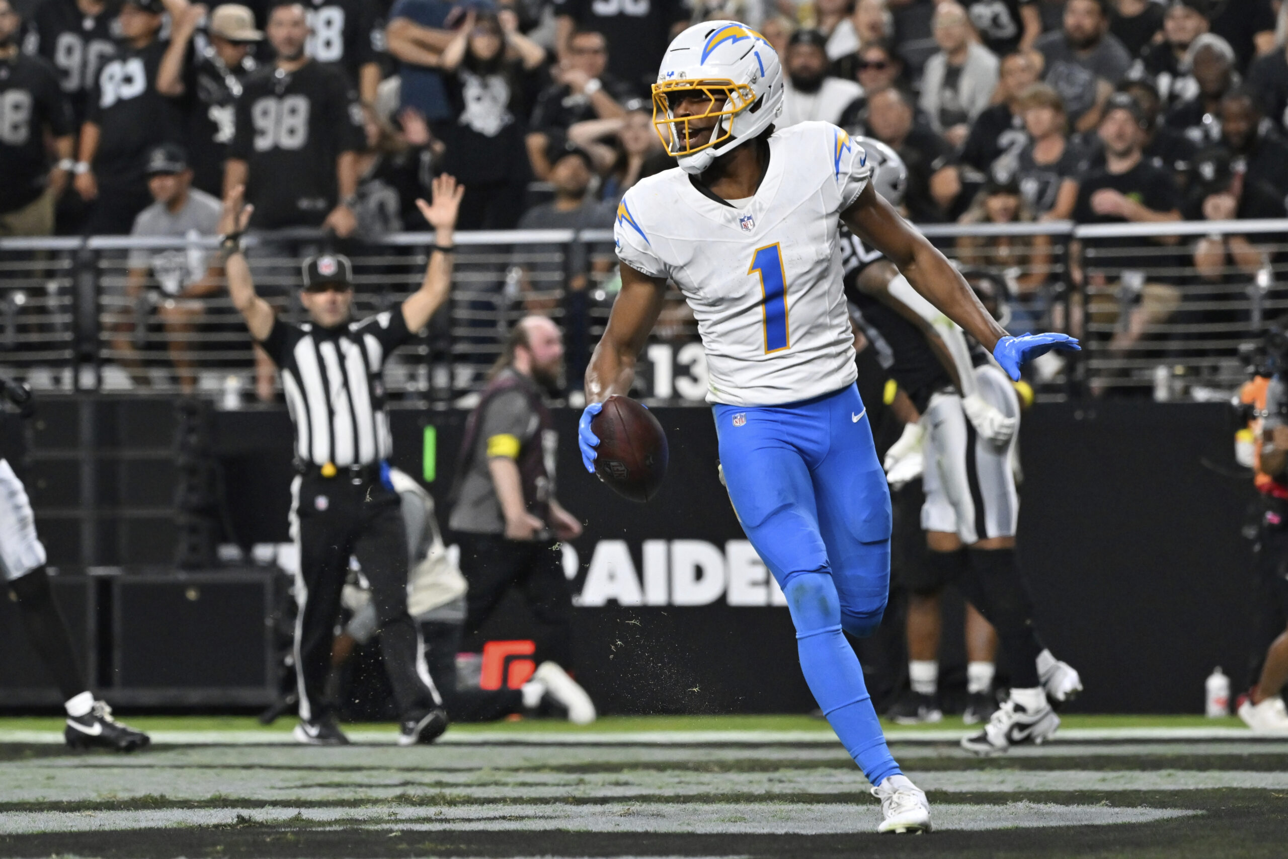 Chargers wide receiver Quentin Johnston celebrates after scoring a touchdown...