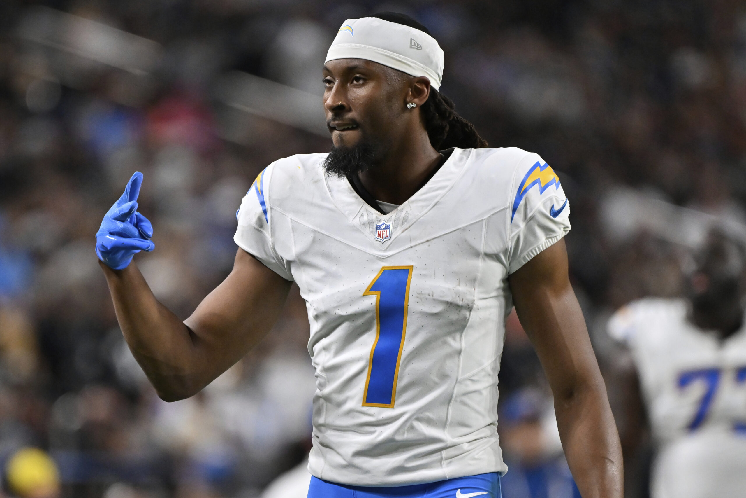Chargers wide receiver Quentin Johnston gestures after the first half...